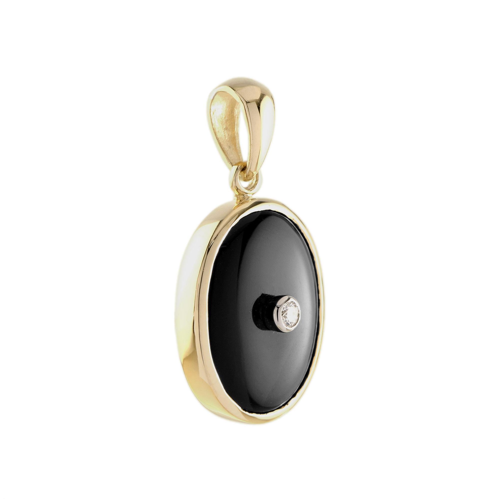 This Art Deco style pendant features onyx in a beautifully ornate 9k yellow gold oval shape setting with a small bezel set diamond in the center. A fine piece jewelry you will cherish in your collection. Pair it with the same design ring to complete