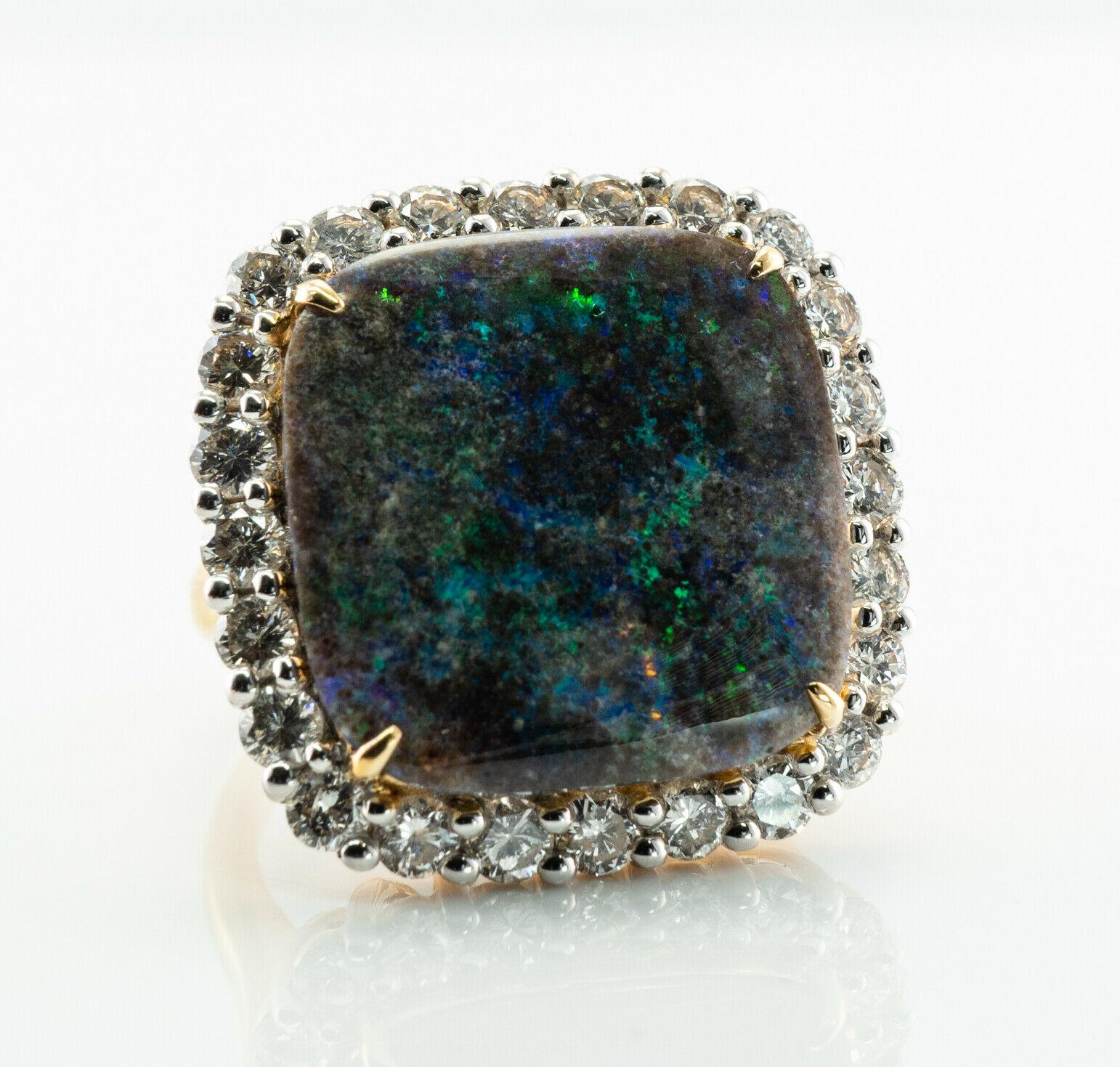 Diamond Black Opal Ring 14K Gold Cocktail Vintage

This stunning vintage ring is finely crafted in solid 14K Yellow Gold (stamped and guaranteed), and it is set with genuine Black Opal and diamonds. The center square Opal cabochon measures 18mm x