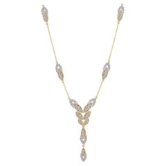 Long collier en or 18 carats et diamants en forme de fleur