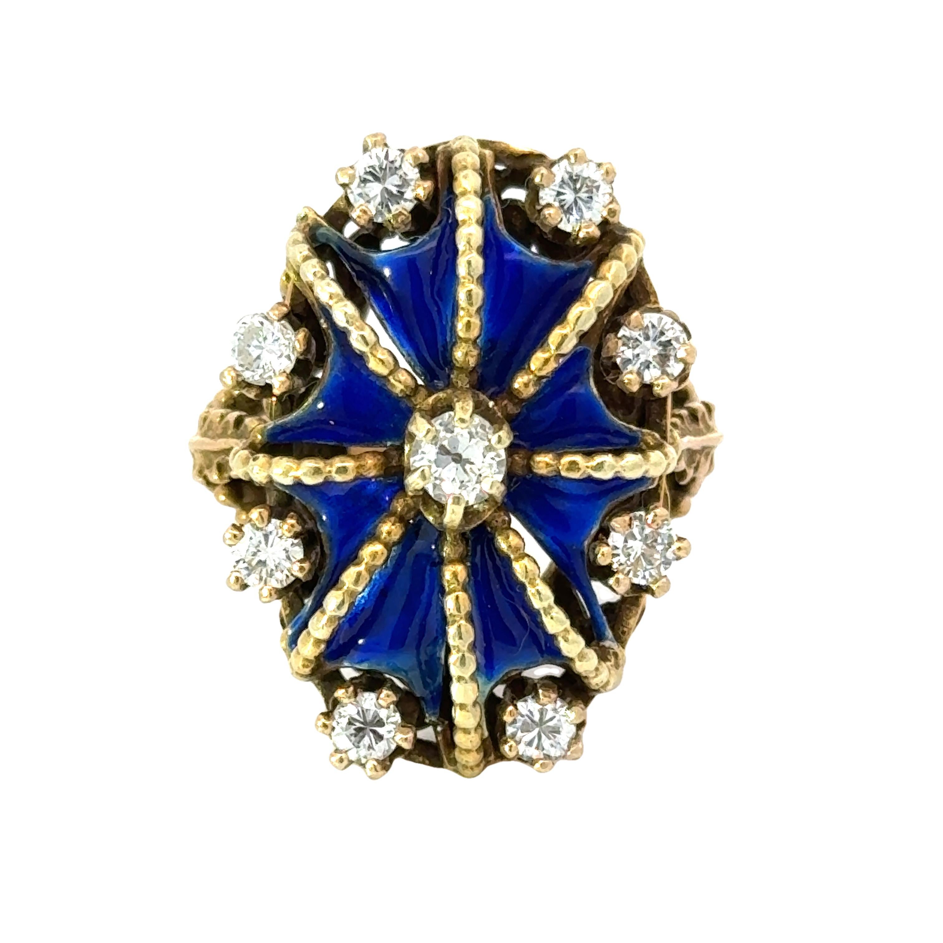 This antique ring in 14K yellow gold is regal in design, featuring a crown-like blue enamel and sparkling diamonds. Crafted with intricate details, this piece exudes a timeless elegance fit for royalty. Perfect for those seeking a vintage touch to