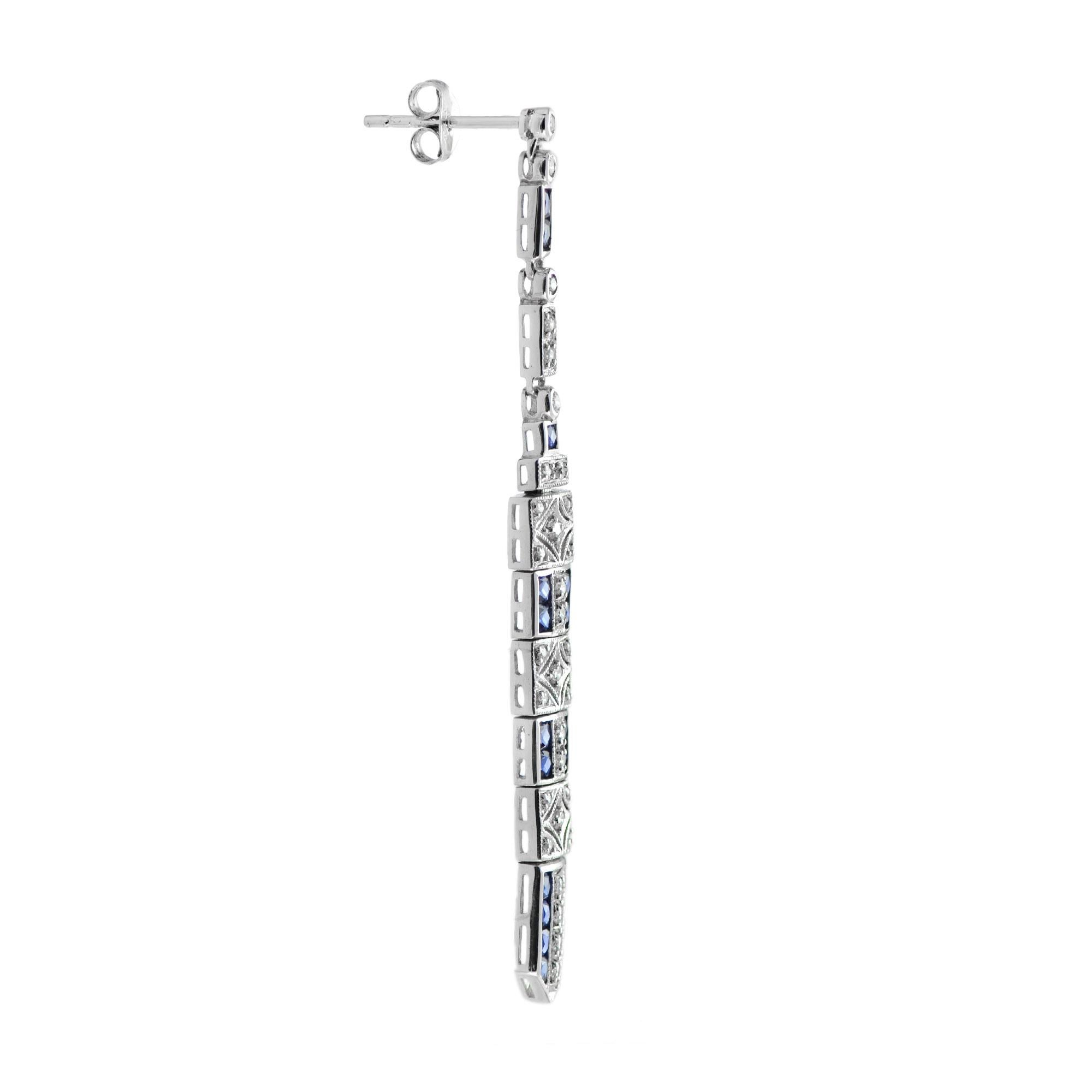 These art deco bar dangle earrings are the epitome of vintage-inspired elegance featuring mesmerizing geometric patterns feature with sapphire and diamonds.
Information
 Width: 6 mm.
 Length: 62 mm.
 Weight: 7.90 g. (approx. total weight)
 Backing: