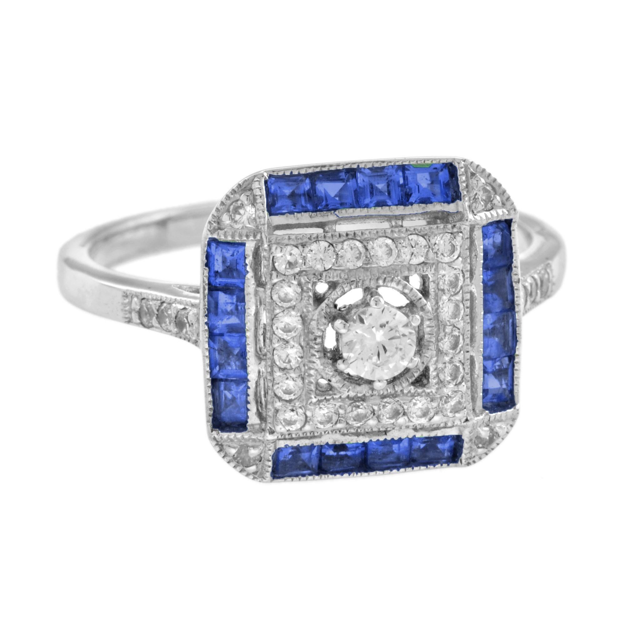 A stunning Art Deco inspired white gold ring. It is set with a 0.11 carat center diamond with thirty diamonds withing square setting. Around it are French cut blue sapphires with diamonds set in to the canted corners. The ring features millgrain