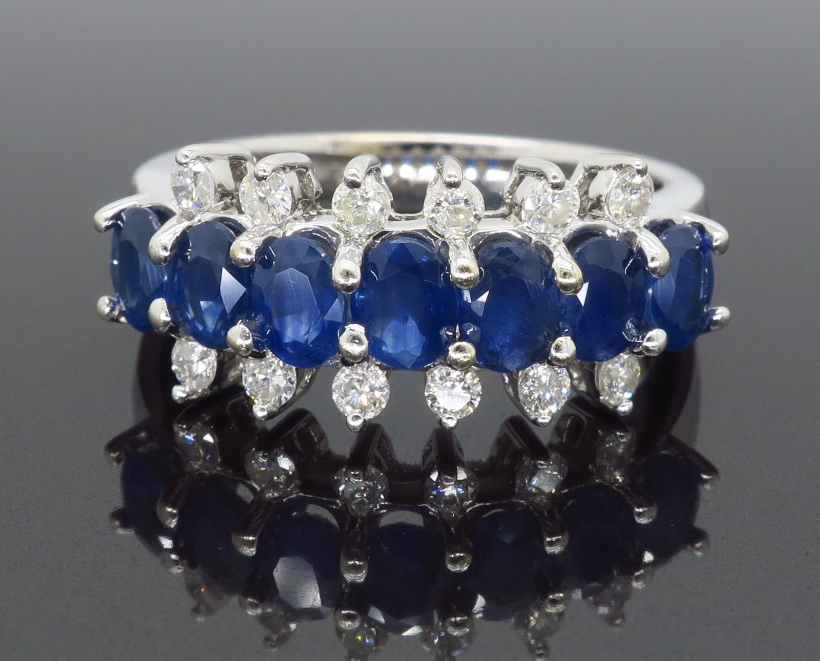 Sapphire and diamond band style ring crafted in 14k white gold. 

Gemstone: Sapphire & Diamond
Gemstone Carat Weight: Approximately 1.60CTW 
Diamond Carat Weight:  Approximately .45CTW
Diamond Cut: Round Brilliant Cut
Color: Average G-I
Clarity: