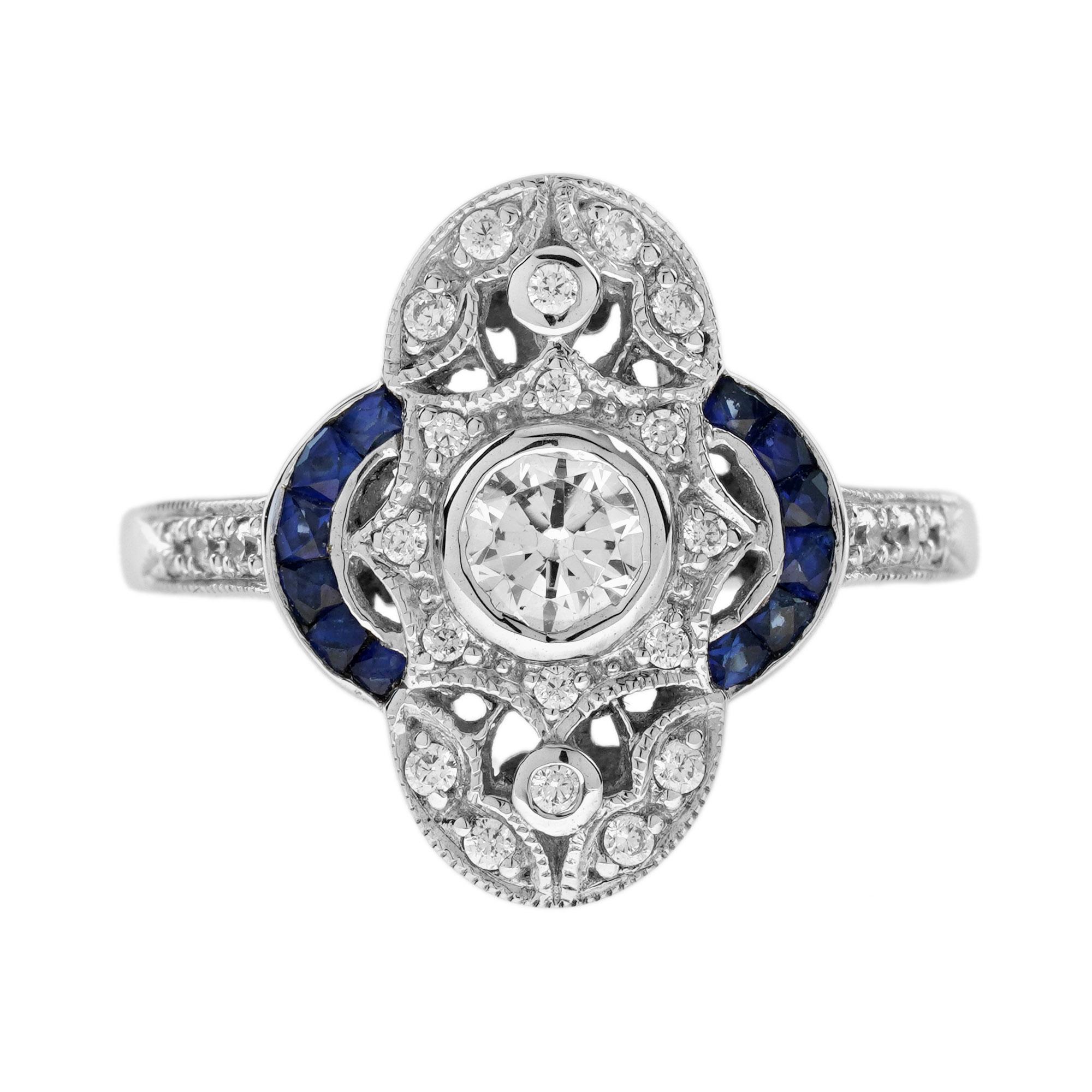 Wunderschöner und ganz besonderer Ring mit antikem Design. Er ist mit einem runden Diamanten von ca. 0,35 Karat in der Mitte verziert. Der Hauptstein ist auf beiden Seiten von Diamanten und halbkreisförmigen Linien aus blauen Saphiren im