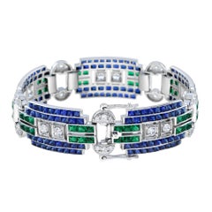 Diamante e zaffiro blu con smeraldo in stile Art Deco Bracciale largo e unico in oro bianco