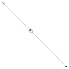 Armband mit Anhängern aus 14-karätigem Gold mit Diamanten, blauen Saphiren und „Evil Eye“-Motiv – edler Schmuck