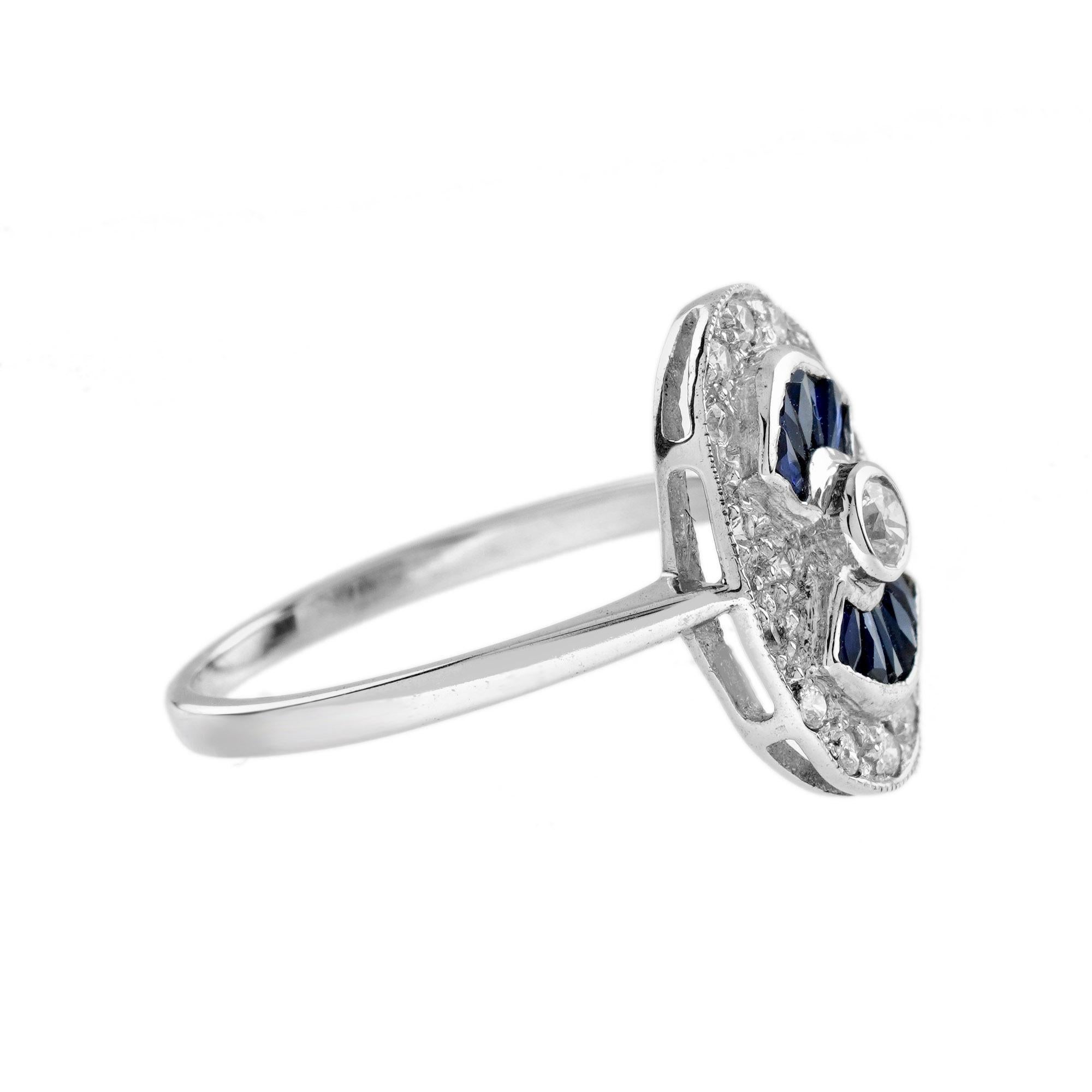 Bague de style Art of Vintage avec un diamant rond de 0,07 carat au centre, un saphir bleu de taille française serti en éventail et d'autres diamants en halo. Le milgrain ajoute au style vintage. Or blanc 14K. 
Informations sur l'anneau
Style :