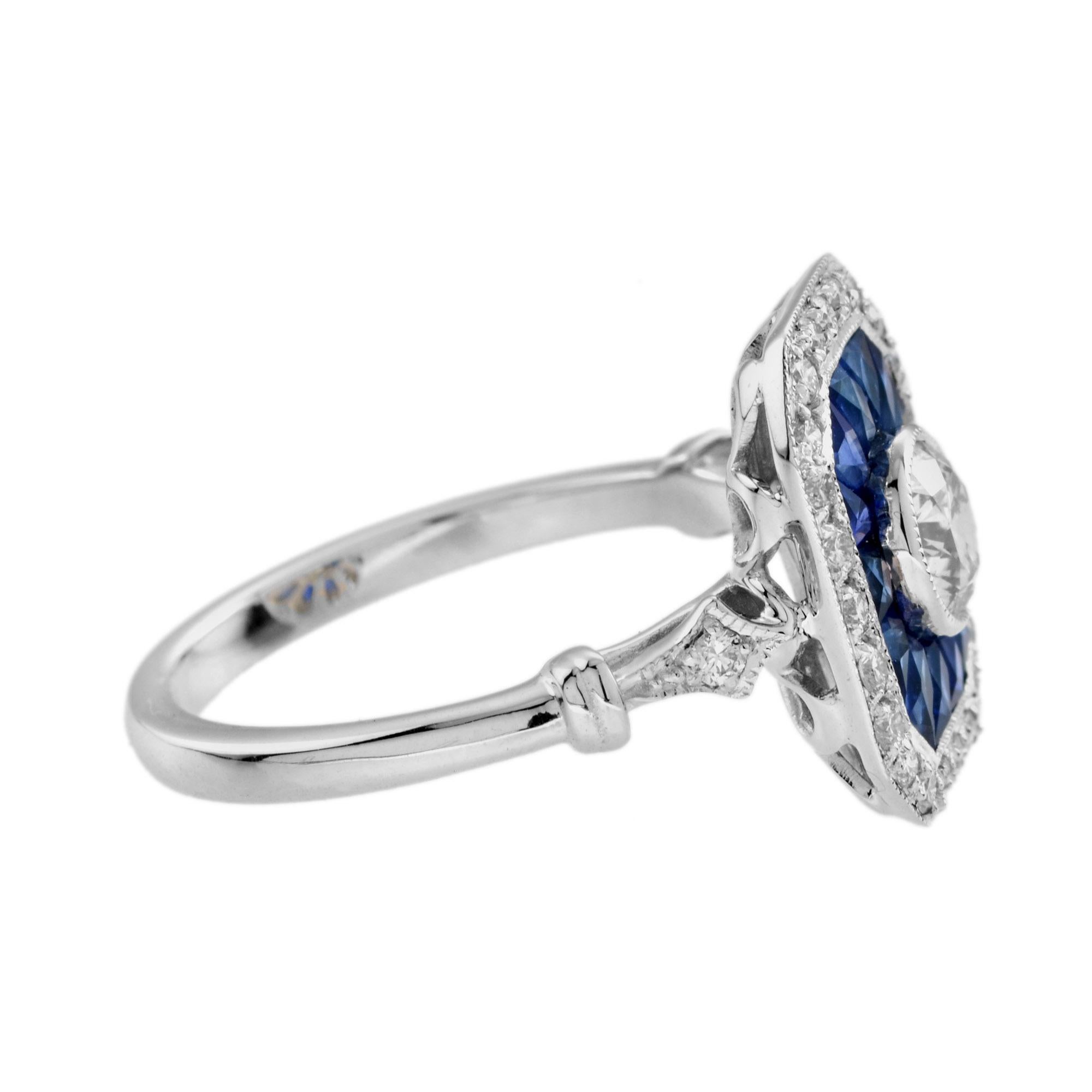 Cette bague d'inspiration Art déco, composée de diamants et de saphirs bleus, est absolument époustouflante. Les saphirs bleus de taille française entourent un diamant rond central, tel un bassin d'eau dans une fontaine. L'éclat se poursuit sur les
