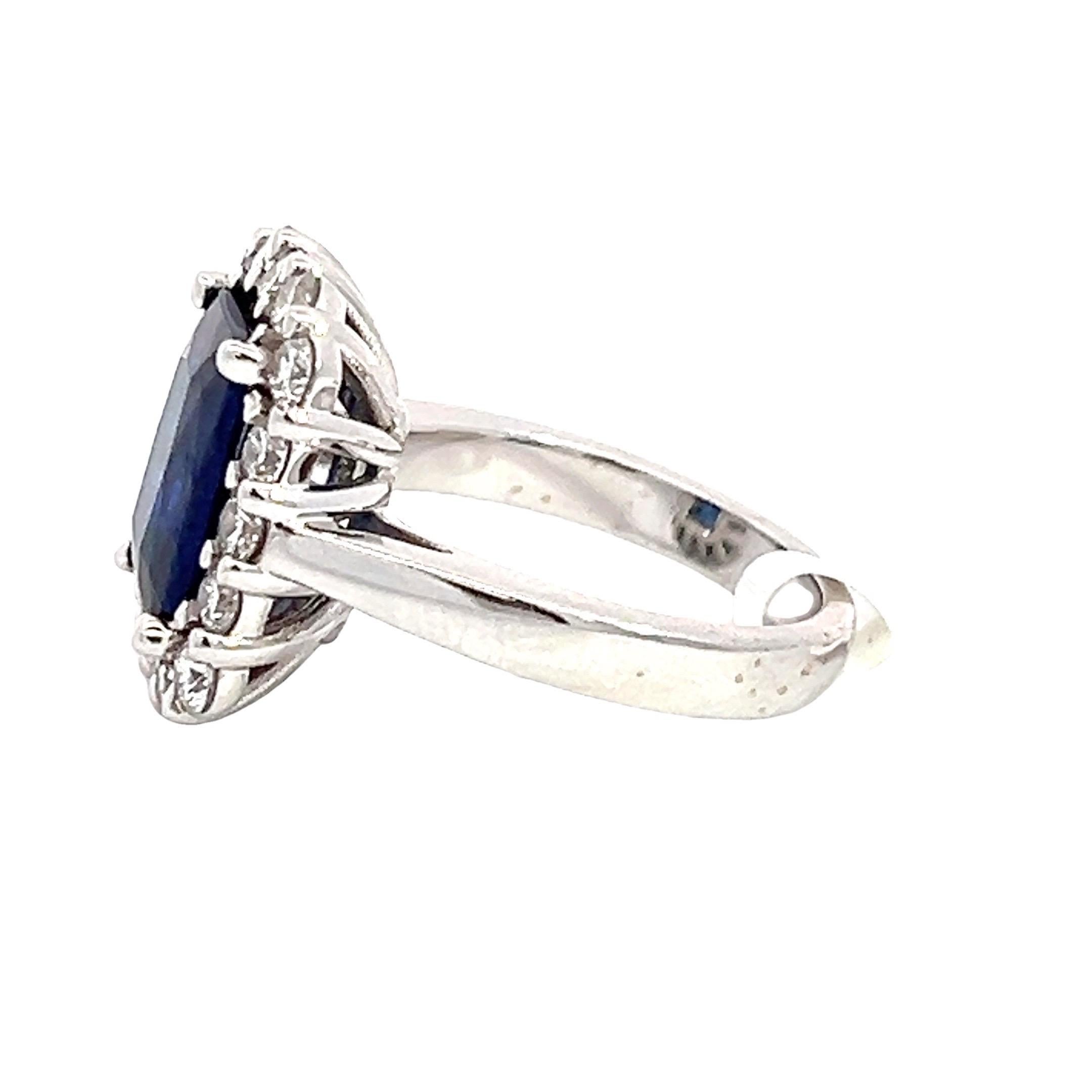 Diamond & Blue Sapphire Ring in 18K White Gold with Natural Diamonds. 
This ring features a stunning natural oval blue sapphire as the centerpiece, set in 18k white gold. The sapphire's rich blue color is accentuated by its high-quality emerald cut,