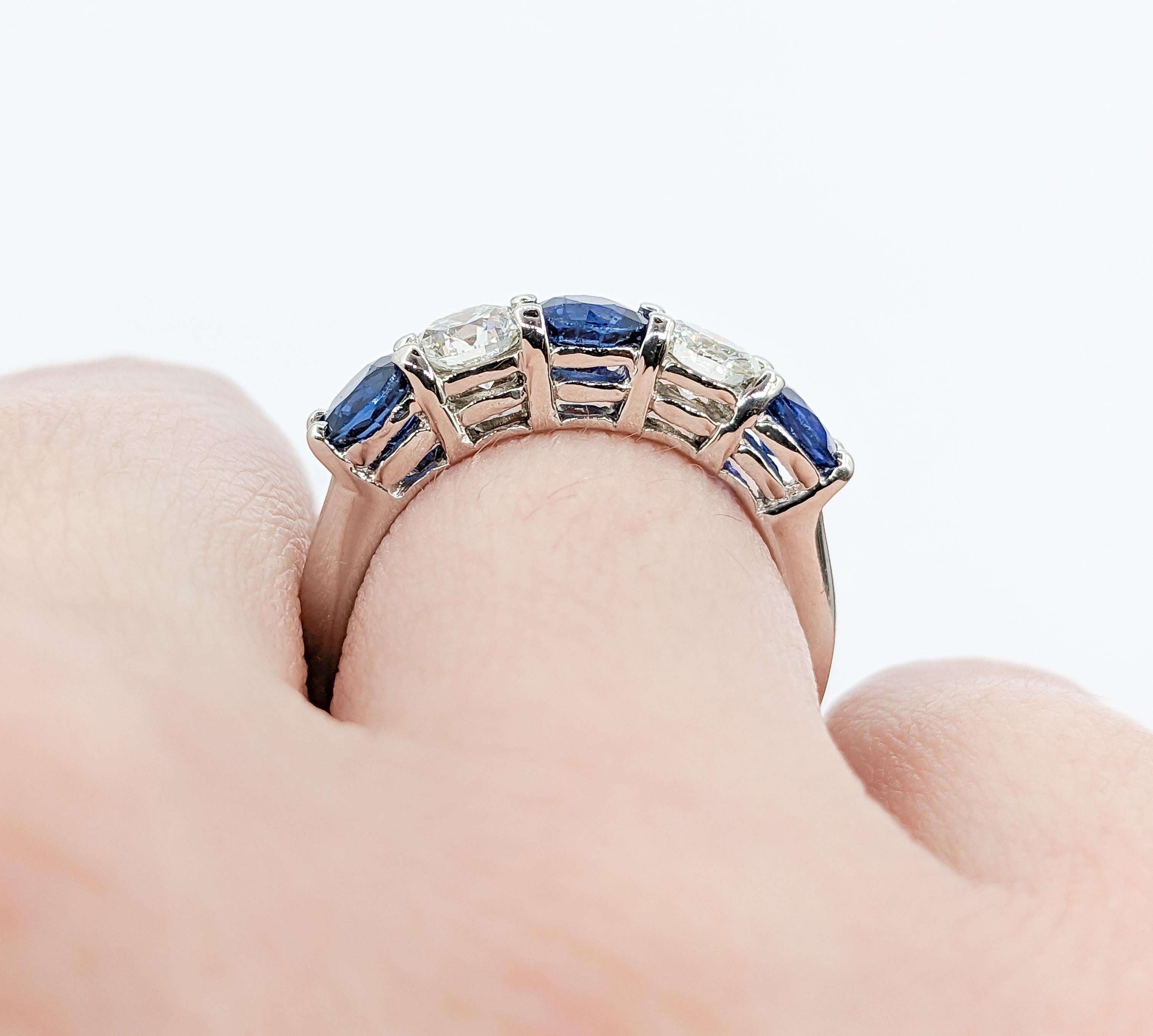 Diamond & Blue Sapphire Ring in Platinum

This beautiful Diamond and Sapphire Ring is expertly crafted in platinum and showcases a total of 0.66 carats of round diamonds, which dazzle with VS2 clarity and near-colorless color. Complementing the