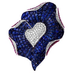 Broche de diamantes, zafiro azul y rubí