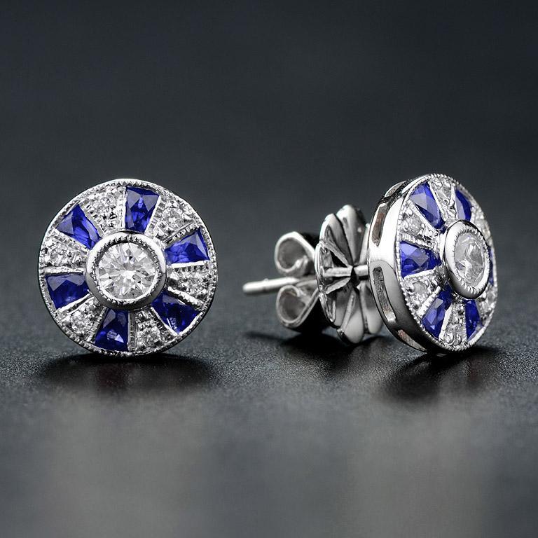 Created in 18K white gold and adorned with French cut sapphires and round diamonds the design is reminiscent of a Ferris Wheel, they have a beautiful elegant feel to them and sit comfortably on the ear.
These earrings would make a wonderful romantic