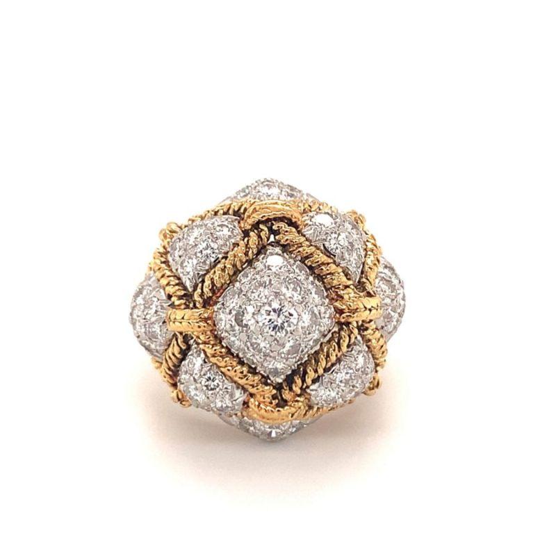 One diamond bombe 18K yellow gold and platinum ring with rope motif gold workmanship enhanced by 67 pave-set, round diamonds weighing approximately 3 ct. in total.  Attributed to Hammerman Bros, though hallmark has been removed due to prior ring