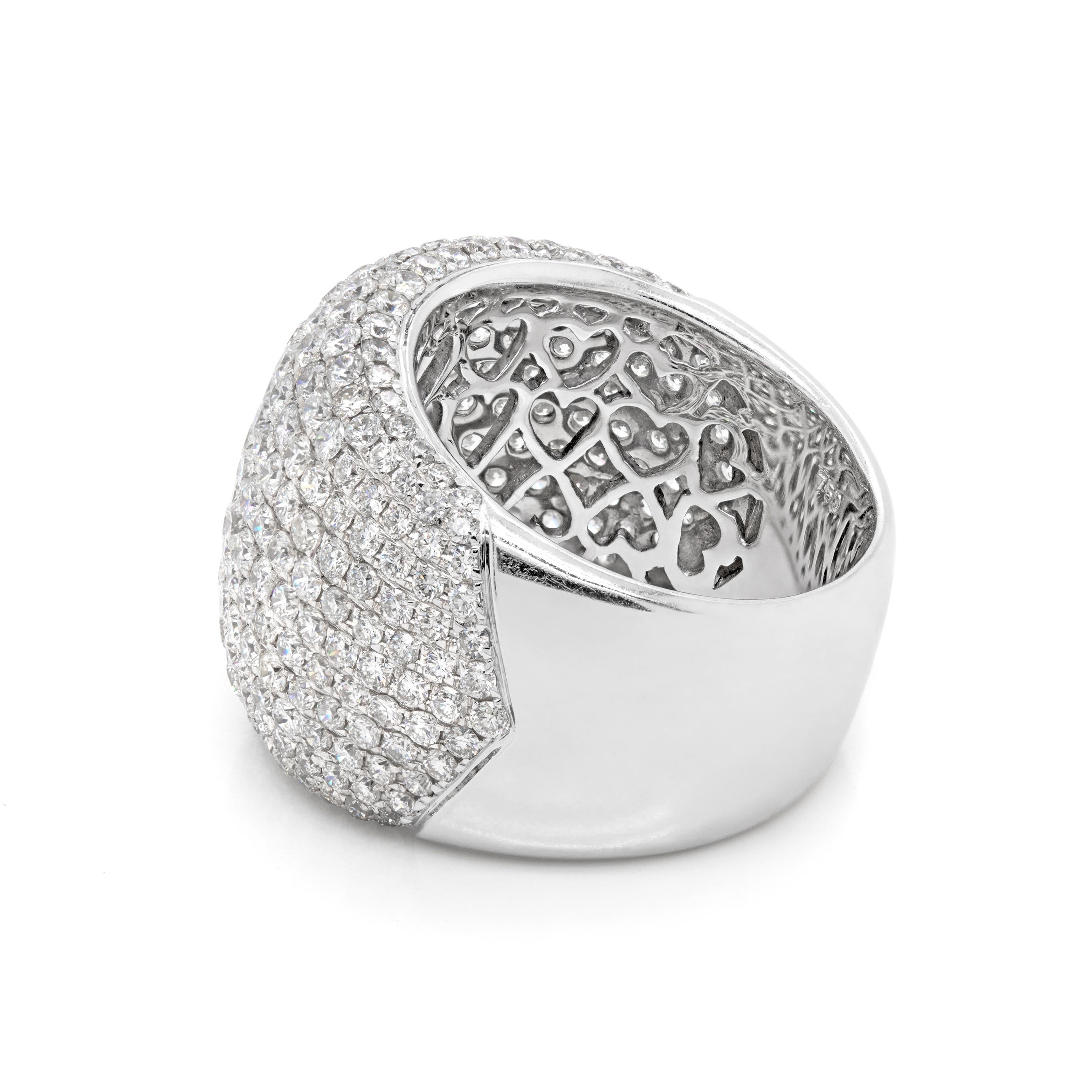 This beautiful bombé cluster ring is set with 288 fine quality round brilliant cut diamonds, micro set in an 18 carat white gold open back mount. The diamonds graduate from 0.015ct on the sides to 0.04ct in the centre totalling to an approximate