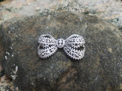Diamond Bow Brooch Set in 18 Karat White Gold Settings