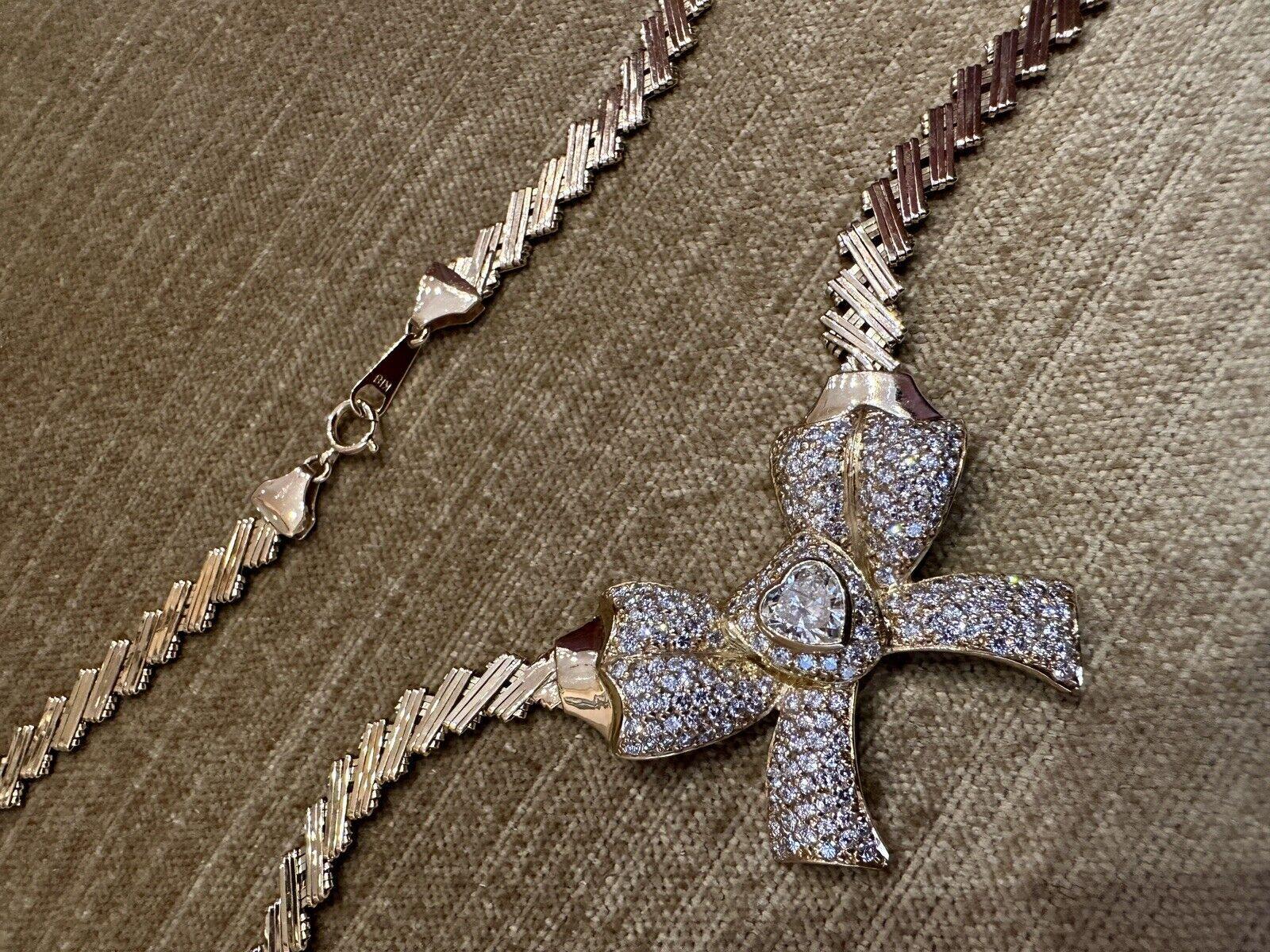 Diamond Bow Necklace with .99 Carat Heart Diamond in 18k Yellow Gold In Excellent Condition For Sale In La Jolla, CA