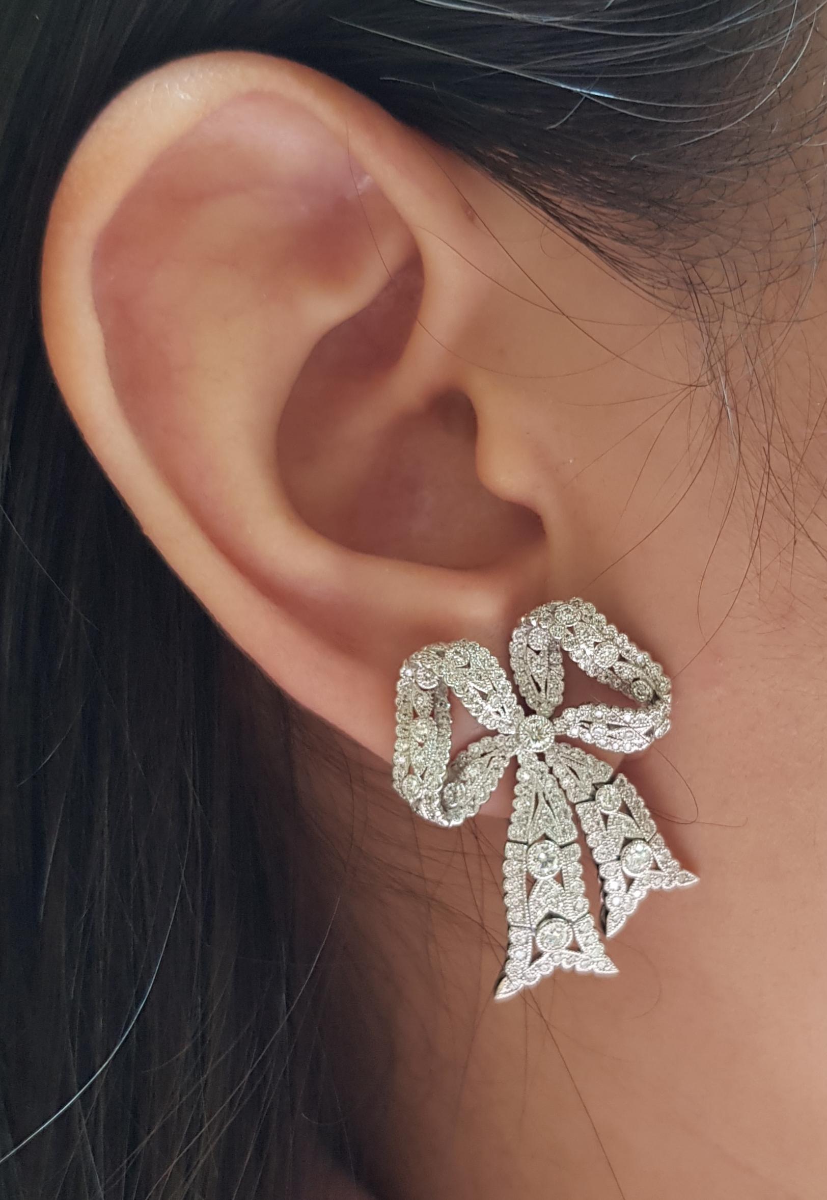 Diamond 1.88 carats Earrings set in 18 Karat White Gold Settings

Width:  2.3 cm 
Length: 3.1 cm
Total Weight: 15.71 grams

