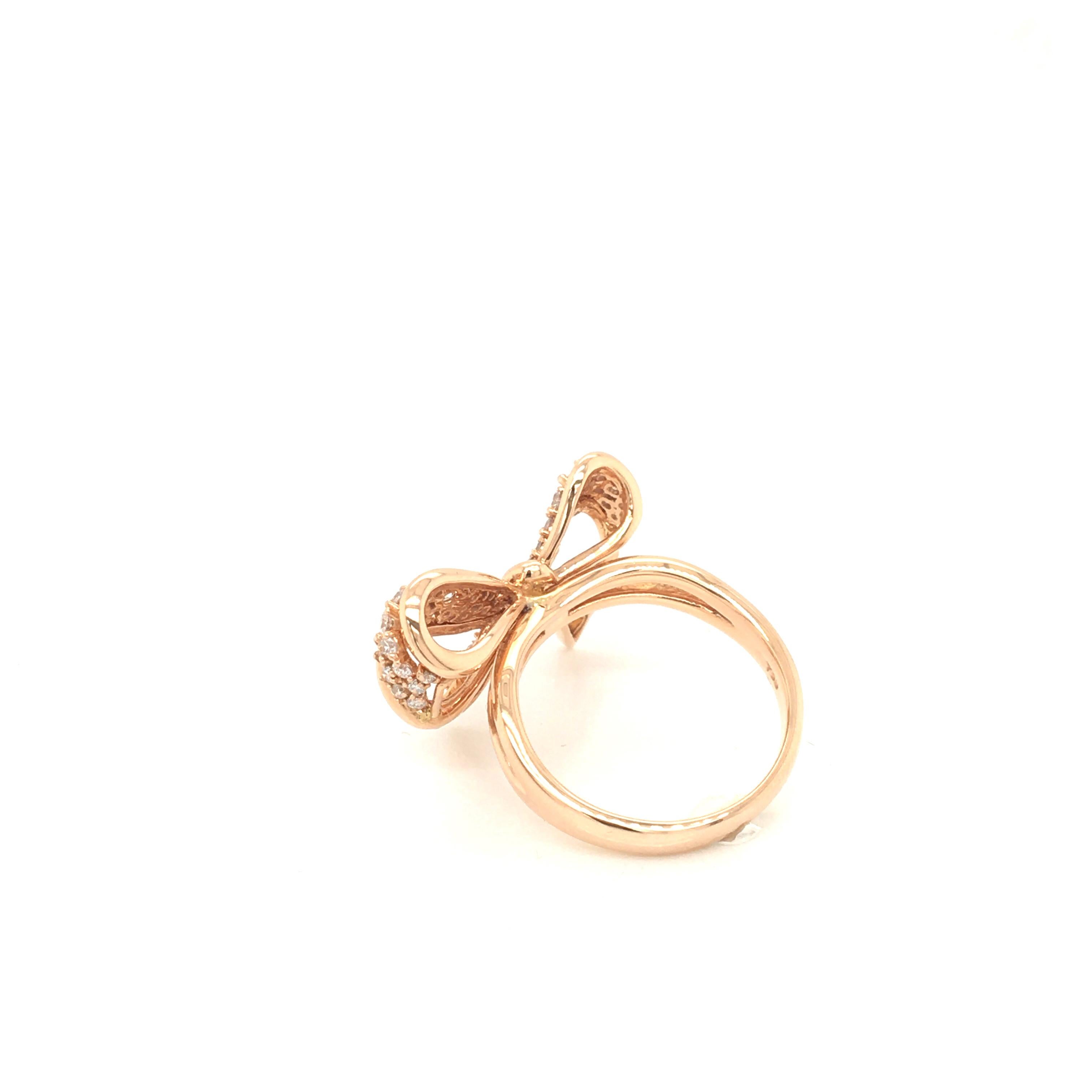 18 KT rose gold Ring, designed as a Bow
set with 0.61 cts of round cut diamonds color G clarity VS
Made in Italy comes in a Box
finger size 14 italian size (adjustable)
comes in a set with Bow pendent