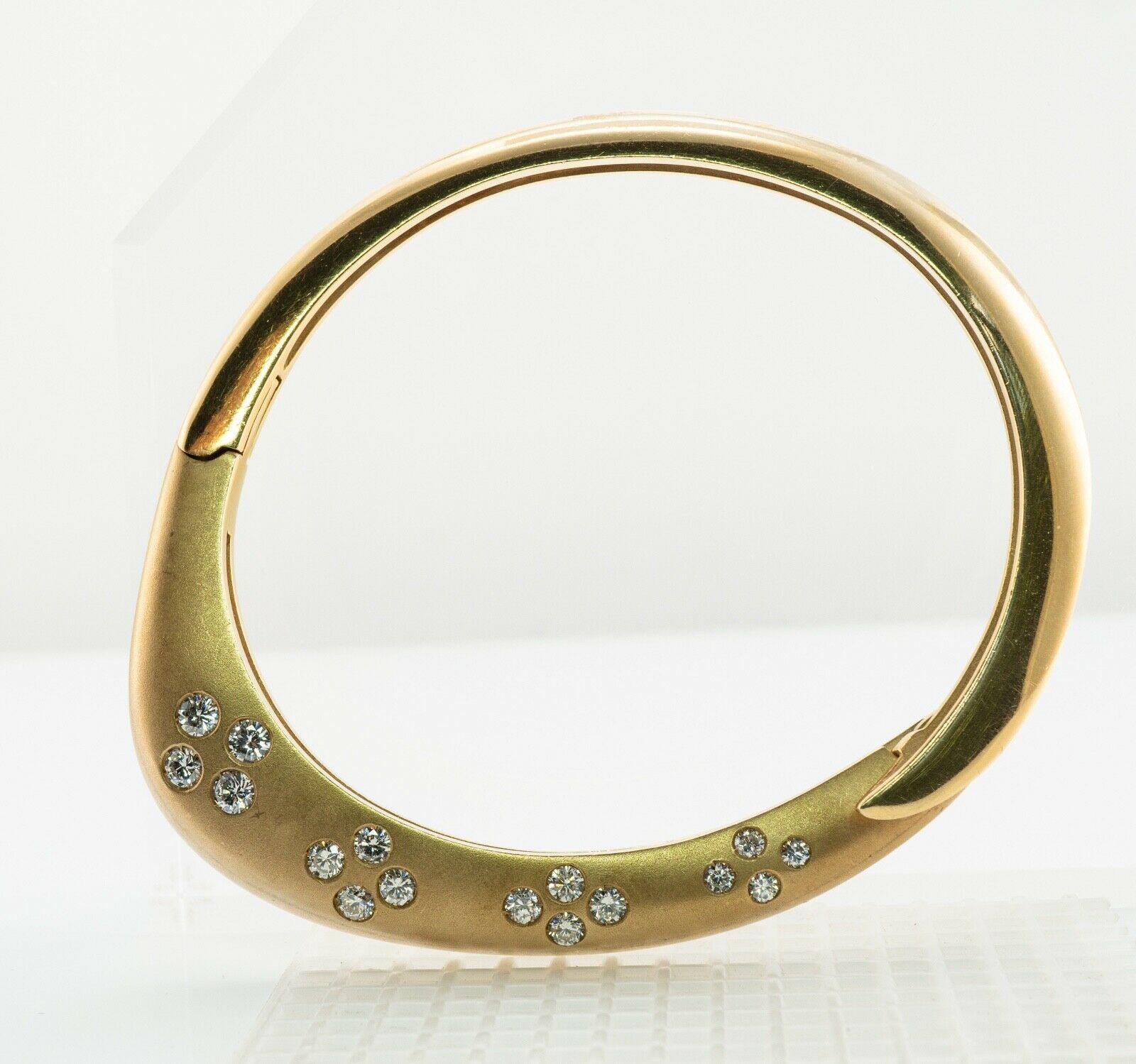 This very unusual and one of a kind bangle bracelet is crated in solid 14K Yellow gold. It is also hallmarked with Jean ©. Sixteen round brilliant cut diamonds are set in brushed gold. They are VS2-SI1 clarity and H color totaling 1.62 carats. The