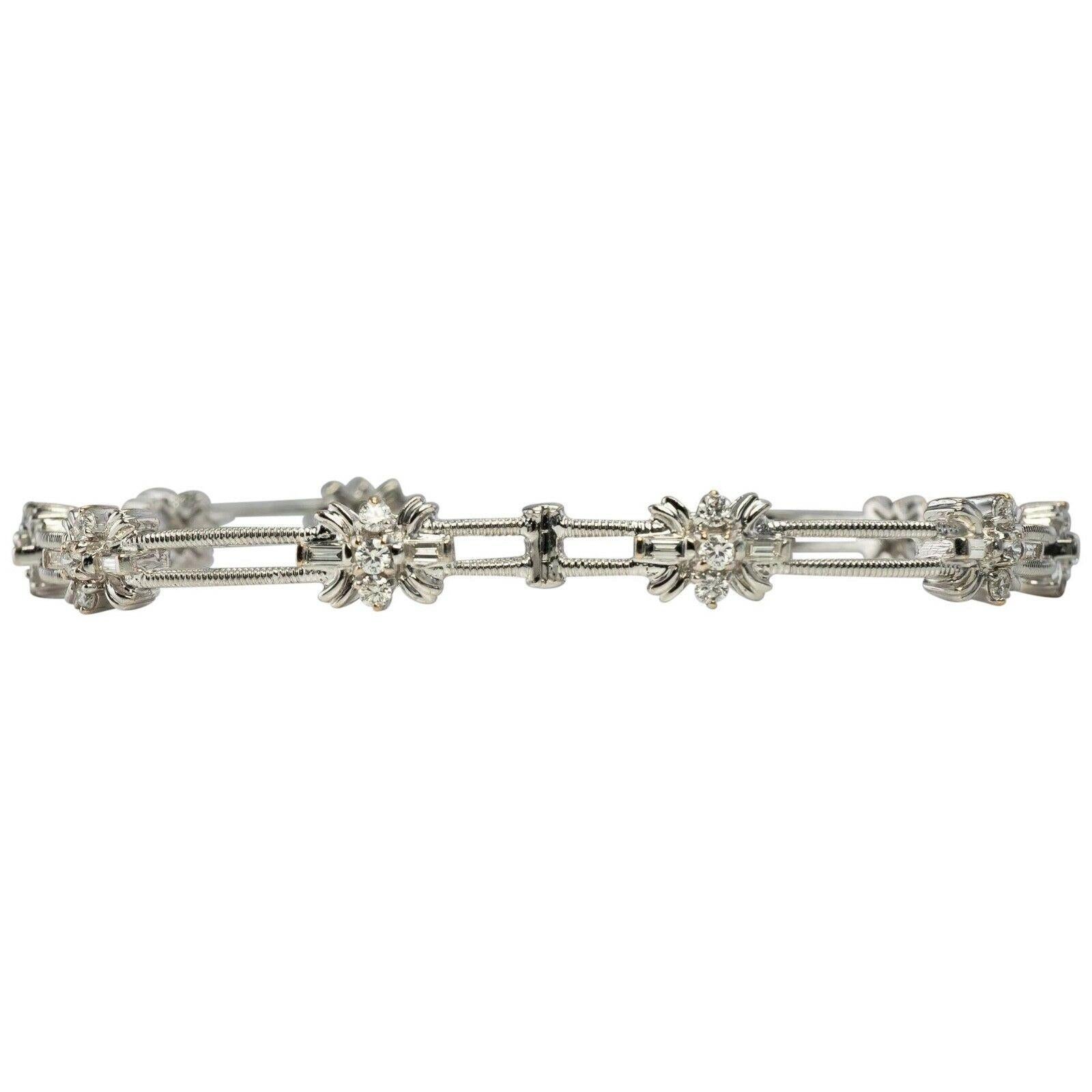 This beautiful estate bracelet is finely crafted in solid 14K White Gold (carefully tested and guaranteed). Each flower-like links holds three round brilliant cut diamonds and two diamond baguettes. The diamonds are estimated to be VVS2 clarity and