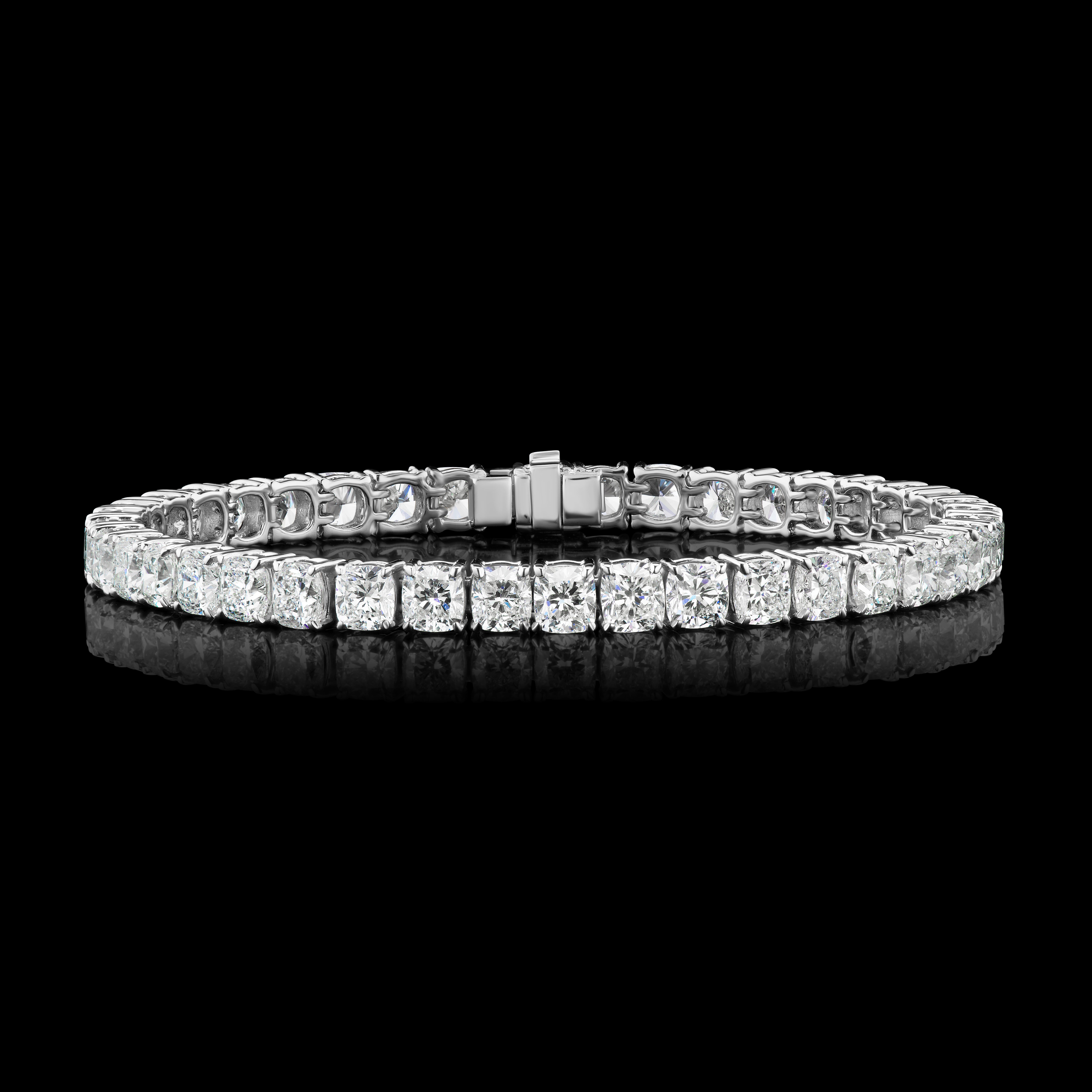 Classic Cushion Diamond Tennis Bracelet in 18K White Gold ( 19.97 ct. tw. )

This diamond bracelet is made using Cushion diamonds which are elegantly set in a straight line, which gives it a very elegant look. Made with matching 40 Cushion diamonds