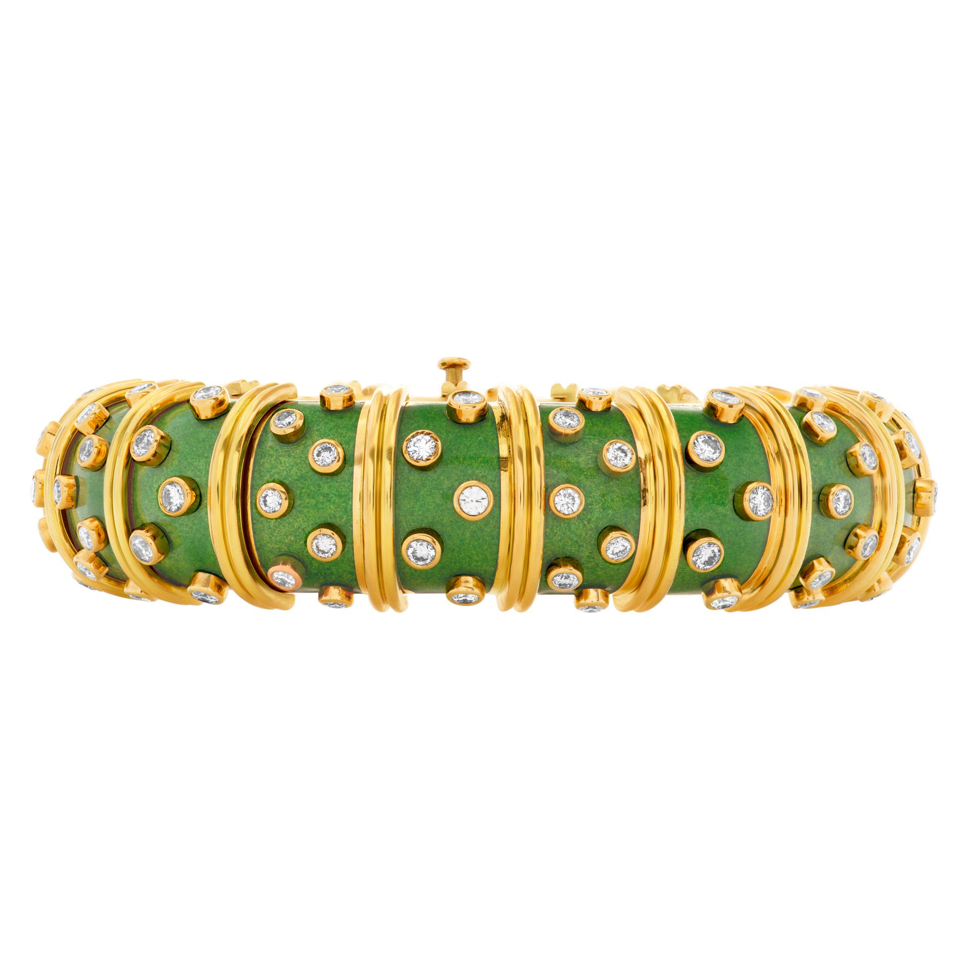 Iconic Tiffany & Co. Schlumberger articulated link bombe bangle in 18k yellow gold with applied green lacquered enamel with alternately spaced ribbed gold stations, studded with approximately 6 carats in bezel-set round brilliant-cut gem-quality