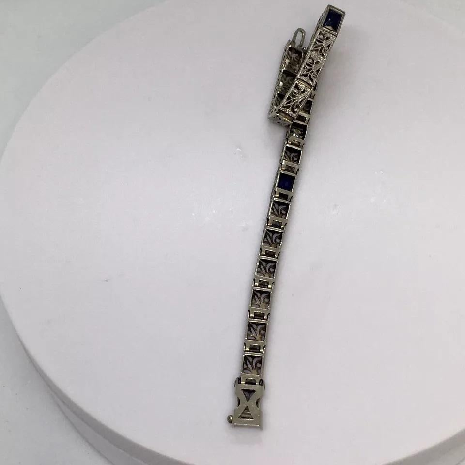 Diamond Bracelet Art Deco 14k white Gold Filigree Antique Sapphire 7 inch 

This stunning bracelet is a true piece of history. Crafted in the Art Deco era (1915-1935), it features a diamond round cut in a 14K white gold setting with intricate