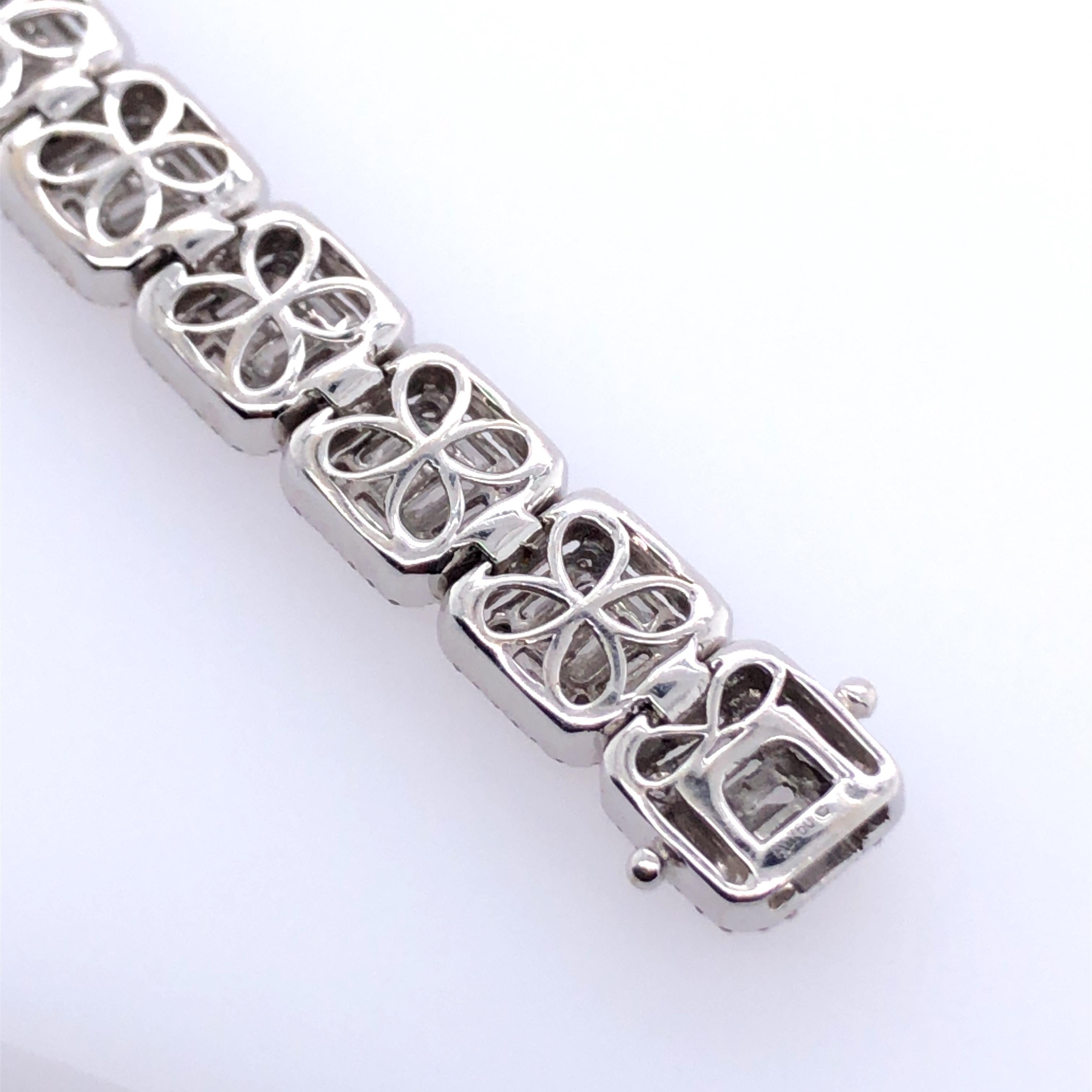 Designed as square links of baguette and round brilliant-cut diamonds
18k white gold 7 ins; Gross weight 28.6 g 18.4 dwts