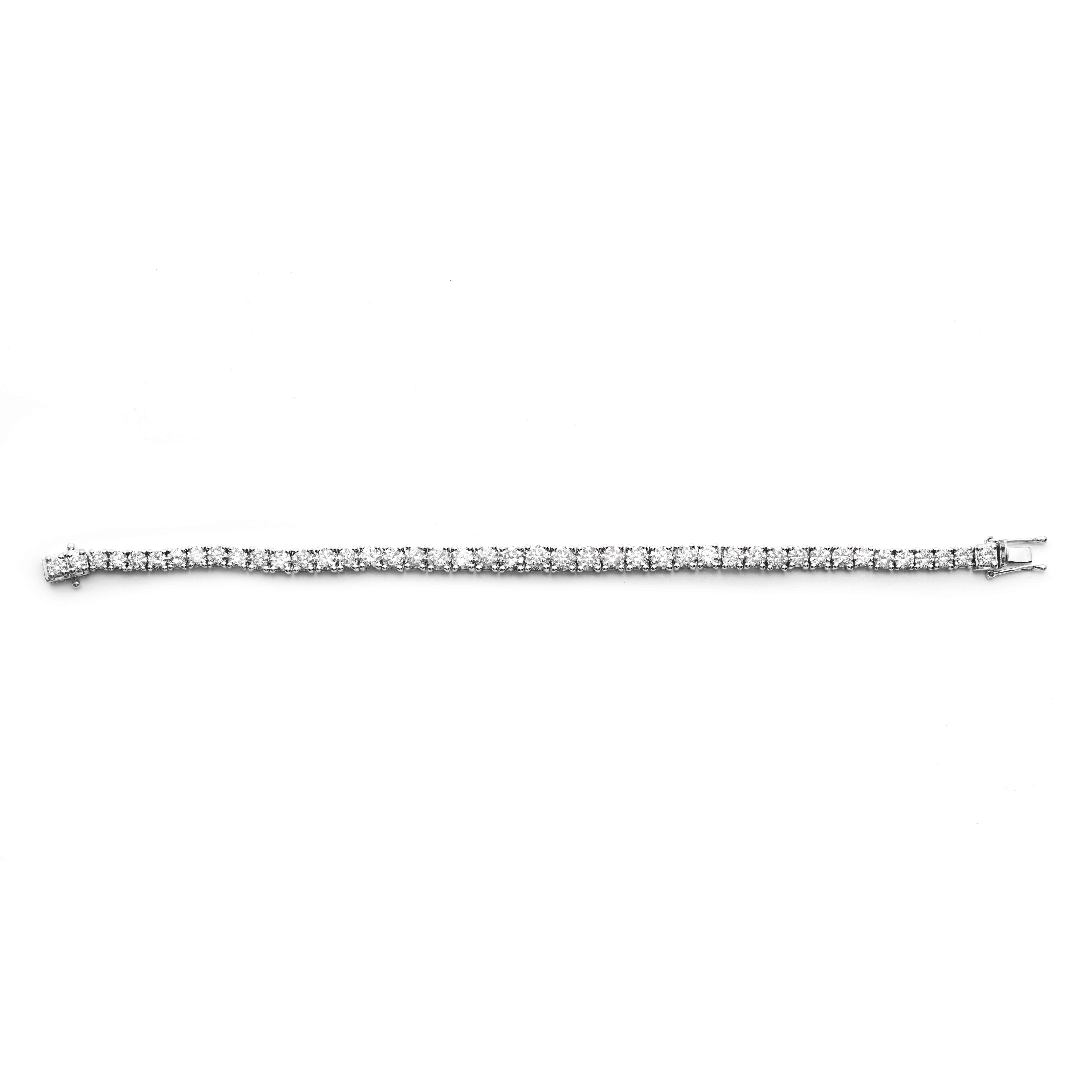 Diamond Bracelet
The tennis bracelet set with forty-three round brilliant-cut diamonds together weighing approximately 11.91 carats, mounted in Platinum, length approximately 7 inches, 29.70 grams (gross)
Accompanied with AIG
