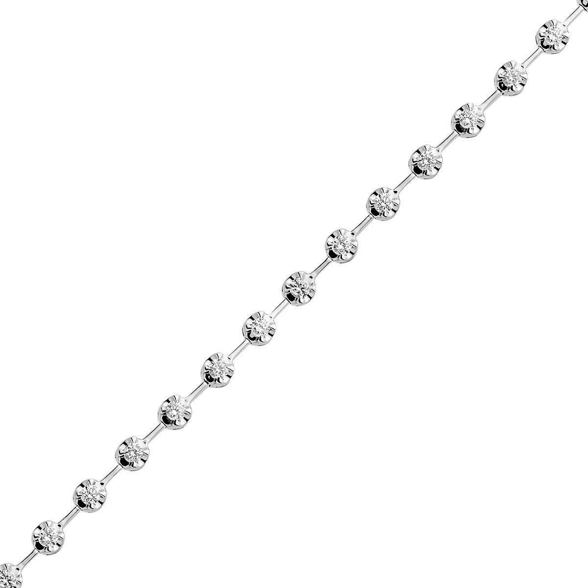 This beautiful bracelet gives a new appearance to the classic tennis bracelet. This 18 karat white gold bracelet weighing 7.7 grams has 30 round VS2, G color diamonds totaling 0.96 carats. 