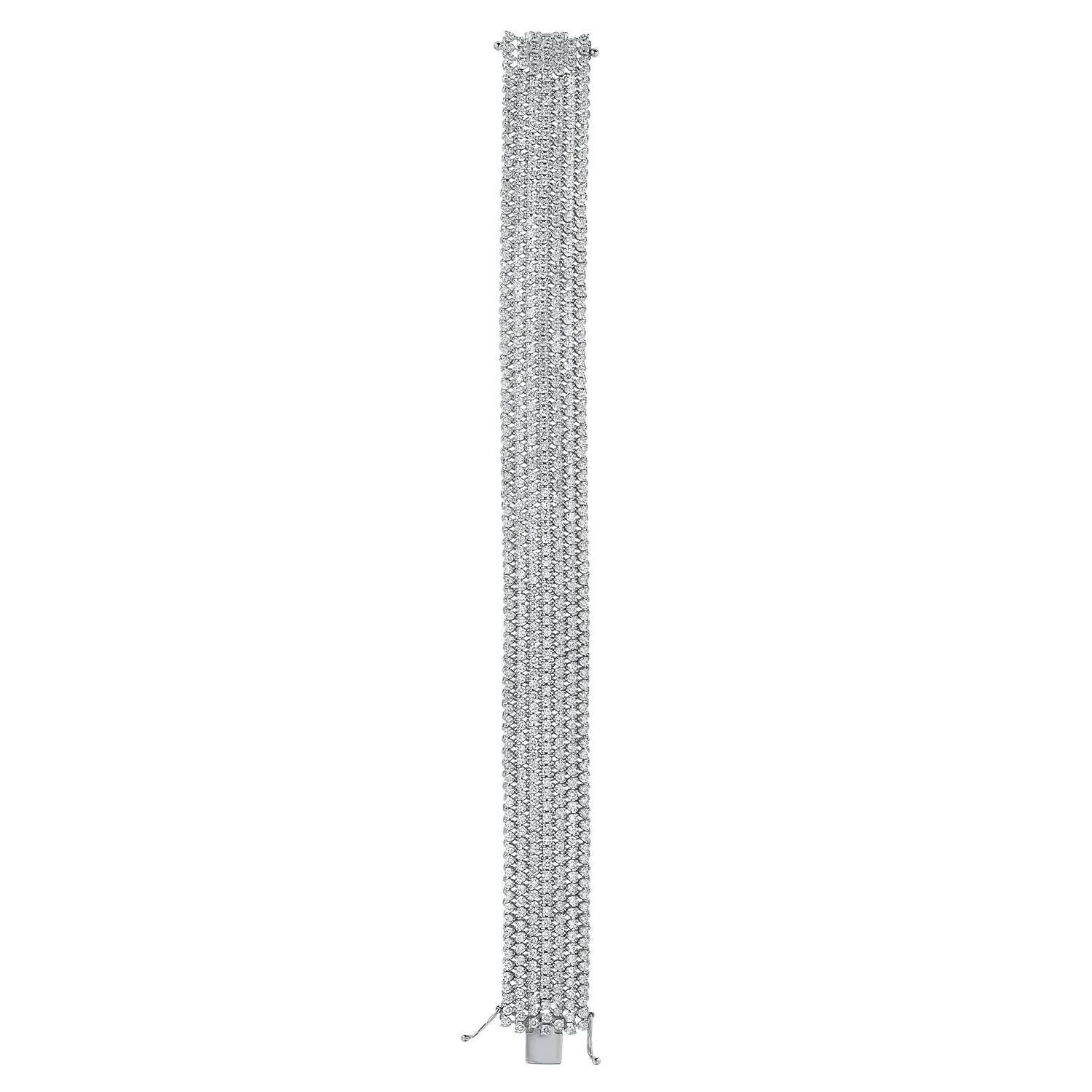Diamond bracelet comprised of 602 round brilliant diamonds weighing a total of 13.08 carats, remarkably hand set in this 18K white gold, completely flexible, mesh diamond bracelet.
Diamond bracelet total length - 7 inches.
Diamond bracelet total