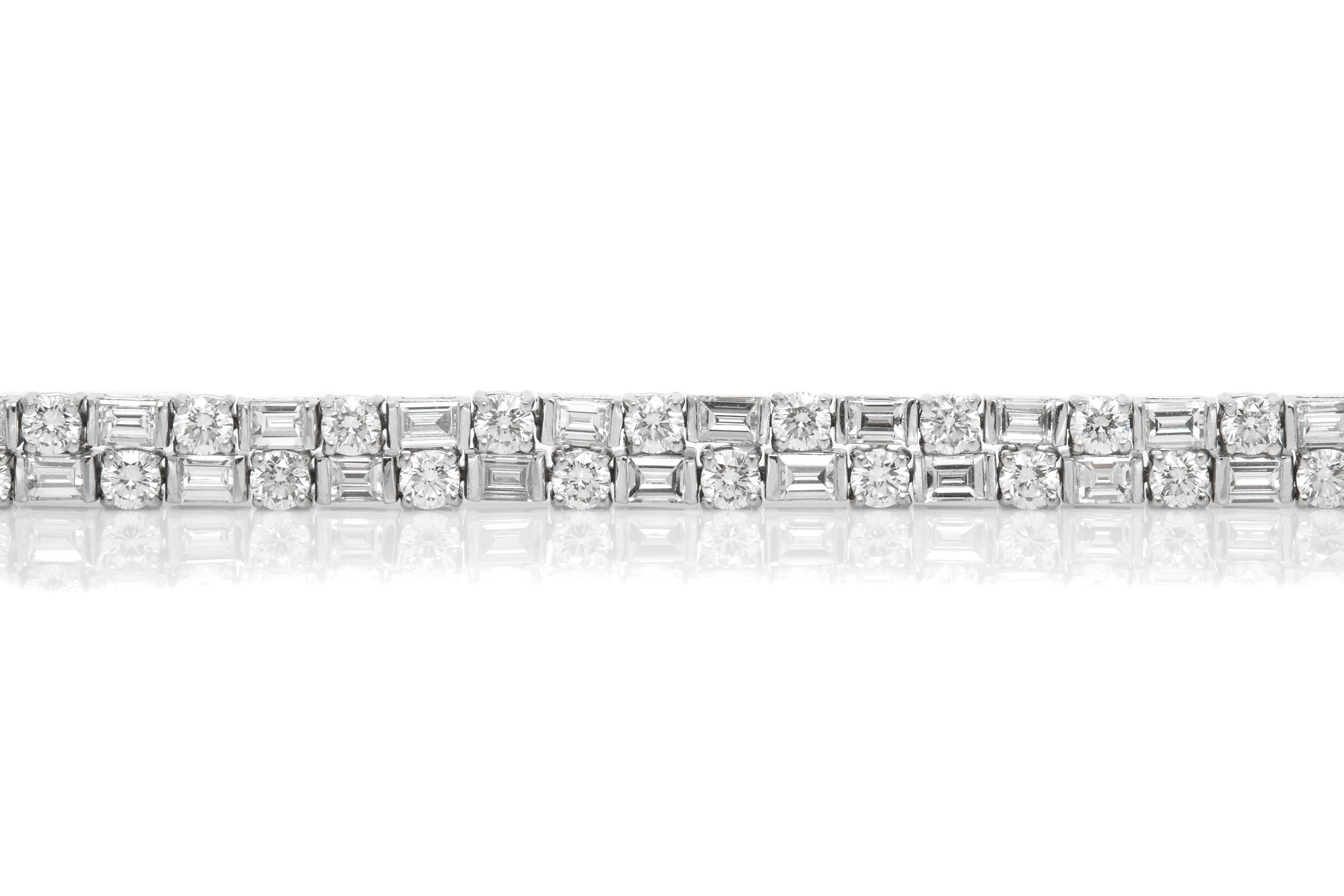 Bracelet, finely crafted in bezel platinum setting with round and emerald cut diamonds weighing approximately a total of 13.81 carat. Circa 2000.