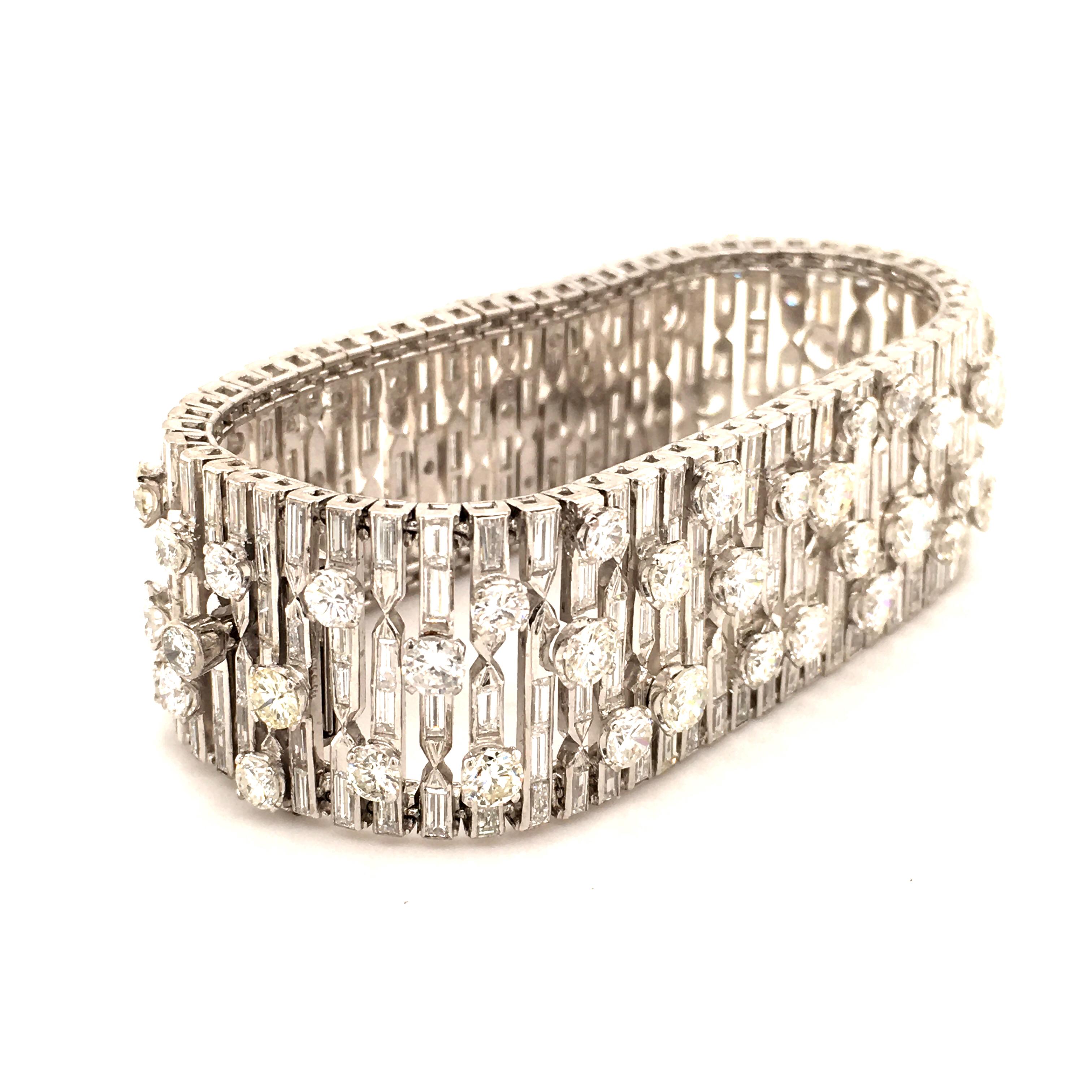 Unique bracelet with diamonds in white gold 14k. Very cool design completed with 229 baguette cut and 70 brilliant cut diamonds totaling 38.25 ct in weight. The round diamonds vary from 0.15 to 0.45 ct. All diamonds are in G/H-vs quality. Box clasp