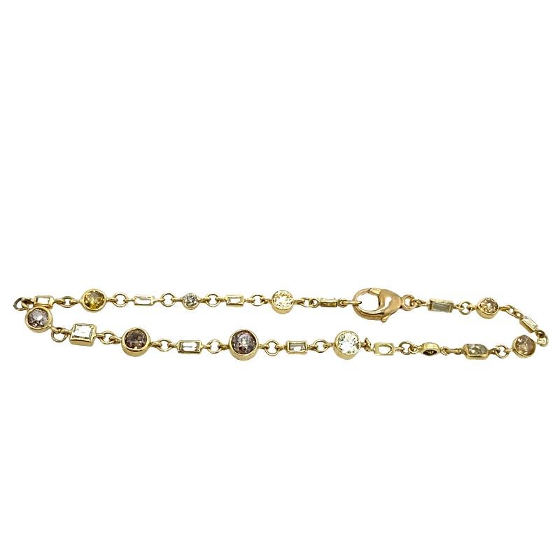 This is a stunning bracelet set with a mix of natural coloured Diamonds. It is a very elegant and classic piece of jewellery, set in 18ct Yellow Gold with 11 baguette shape Diamonds and 10 round brilliant cut mixed natural coloured Diamonds & white