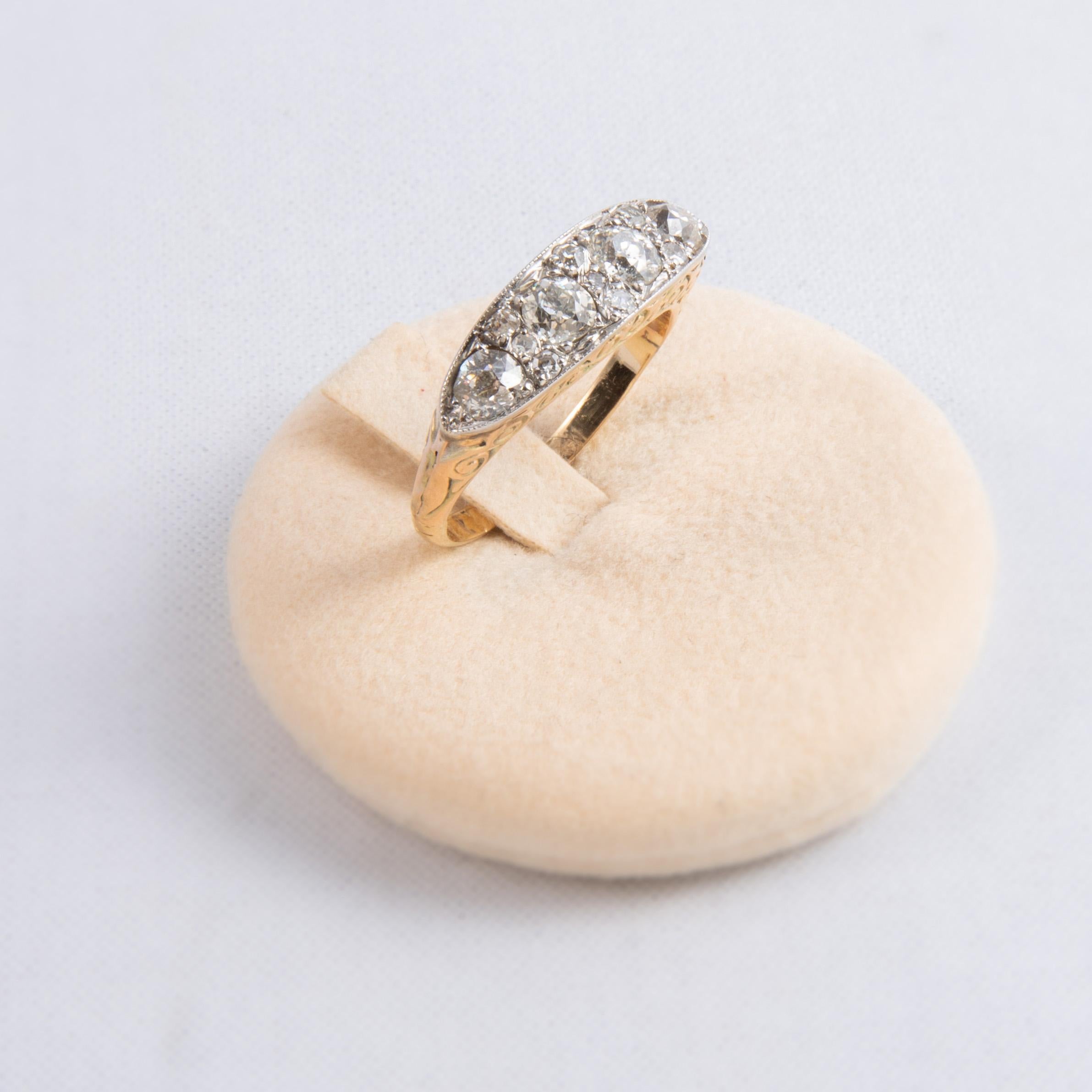 18kt gold ring with engraved stem, 2.50 ct diamond set on silver from the 1920s.