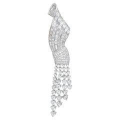 Diamond Ribbon Brooch With A Tassle Crafted In Platinum.