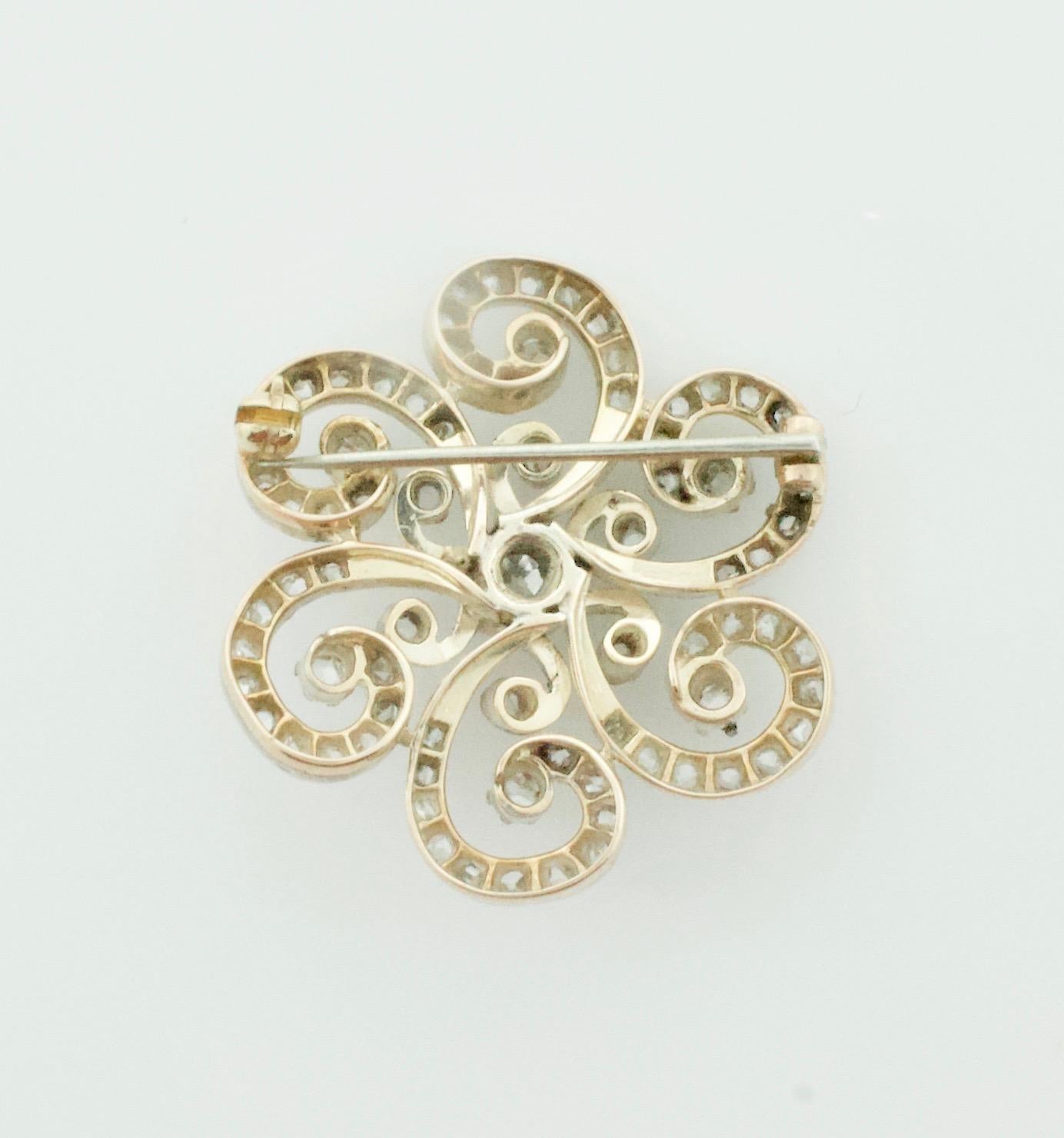 Diamond Brooch in Silver on Yellow Gold Circa 1890
One Old Mine  Cut Diamonds Weighing .45 Carats Approximately '
Seventy Eight Rose Cut Diamonds Weighing 2.00 Carats Approximately 