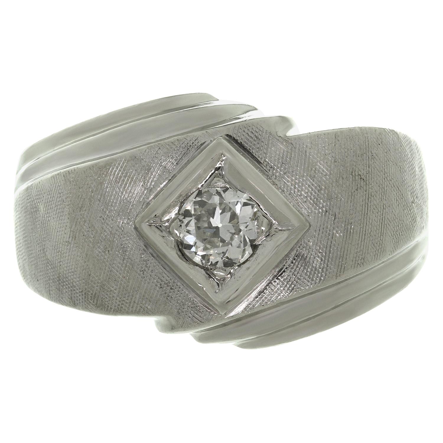 This classic retro men's ring is crafted in 14k textured white gold and set with old European-cut F-G VS1-VS2 diamond of an estimated 0.40 carats. Made in United States circa 1940s. Measurements: 0.51