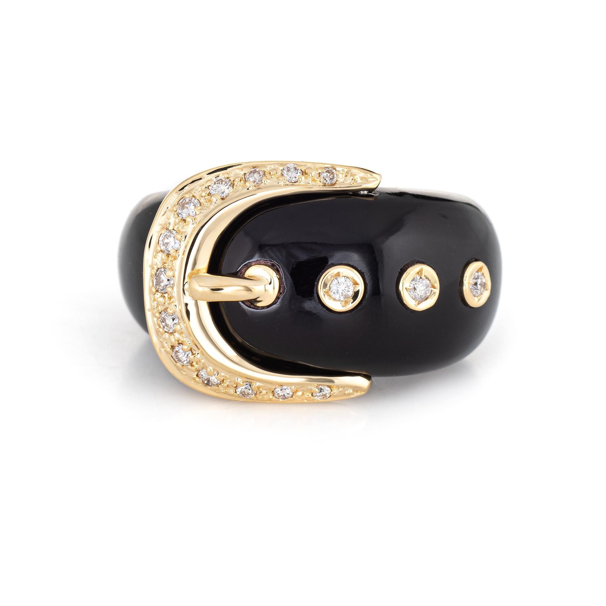 Stylish black resin diamond buckle ring crafted in 18 karat yellow gold. 

Diamonds total an estimated 0.16 carats (estimated at I-J color and SI1-I1 clarity). 

The black resin band is set with diamonds in 18k yellow gold. The buckle is a symbol of
