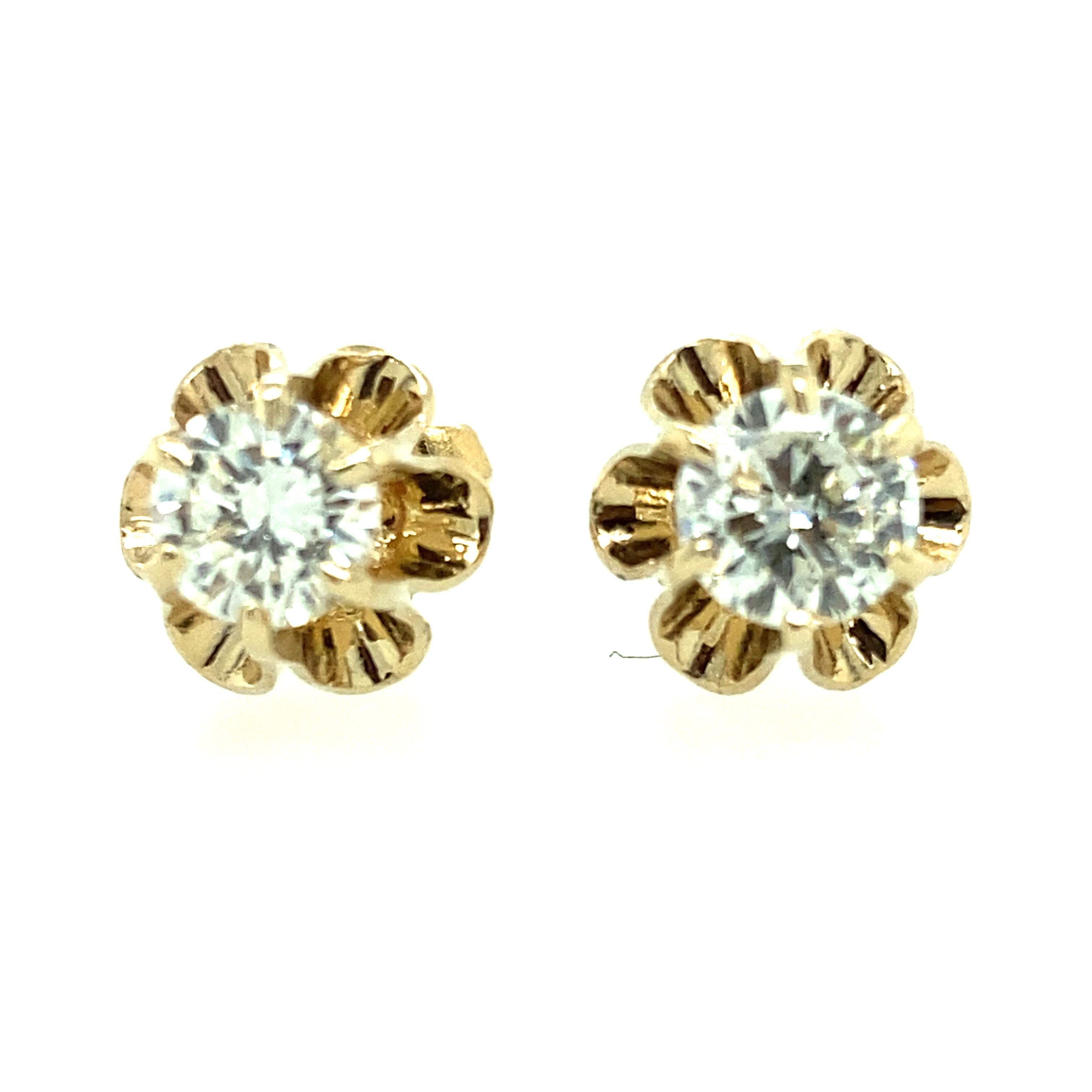 One pair of 14 karat yellow gold estate buttercup diamond earrings, each set with one round brilliant cut diamond, approximately 1.00 carat total weight , with matching I/J color and SI clarity. 
