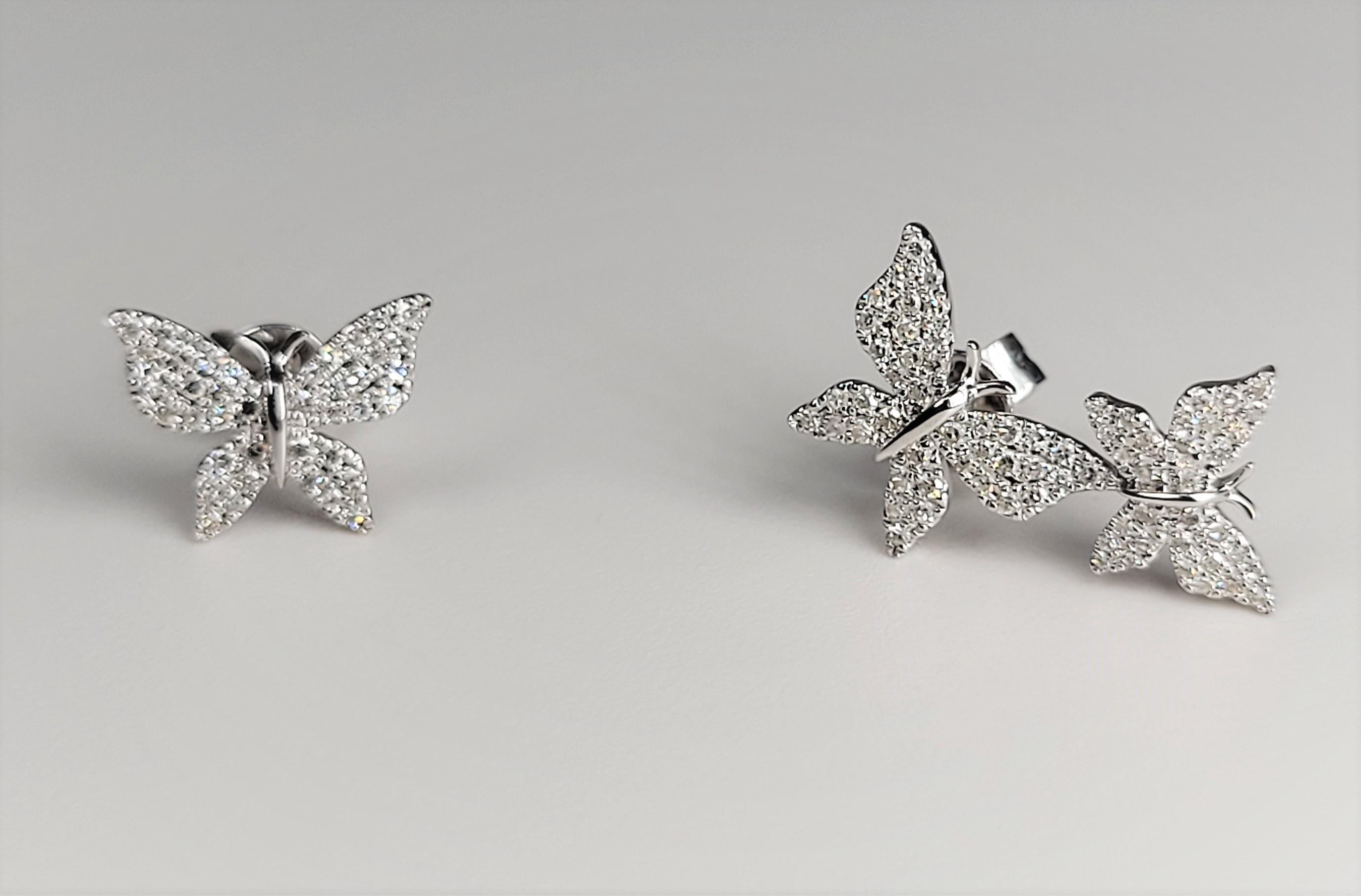 Such an unusual pair of earrings!  The double butterflies on one ear are eye catching!  In 14 Karat White Gold. 