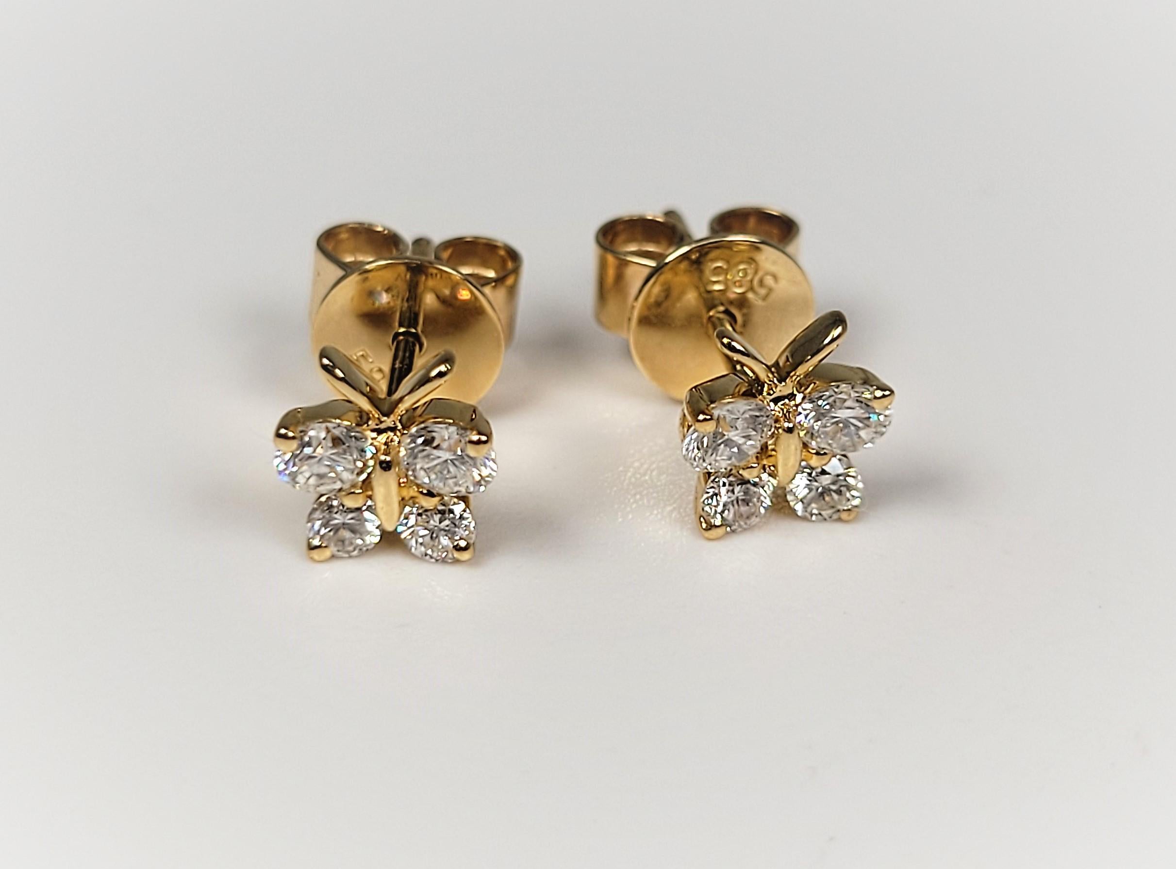 Lovely 0.53 carat diamond butterfly earrings, in 14 karat yellow gold.