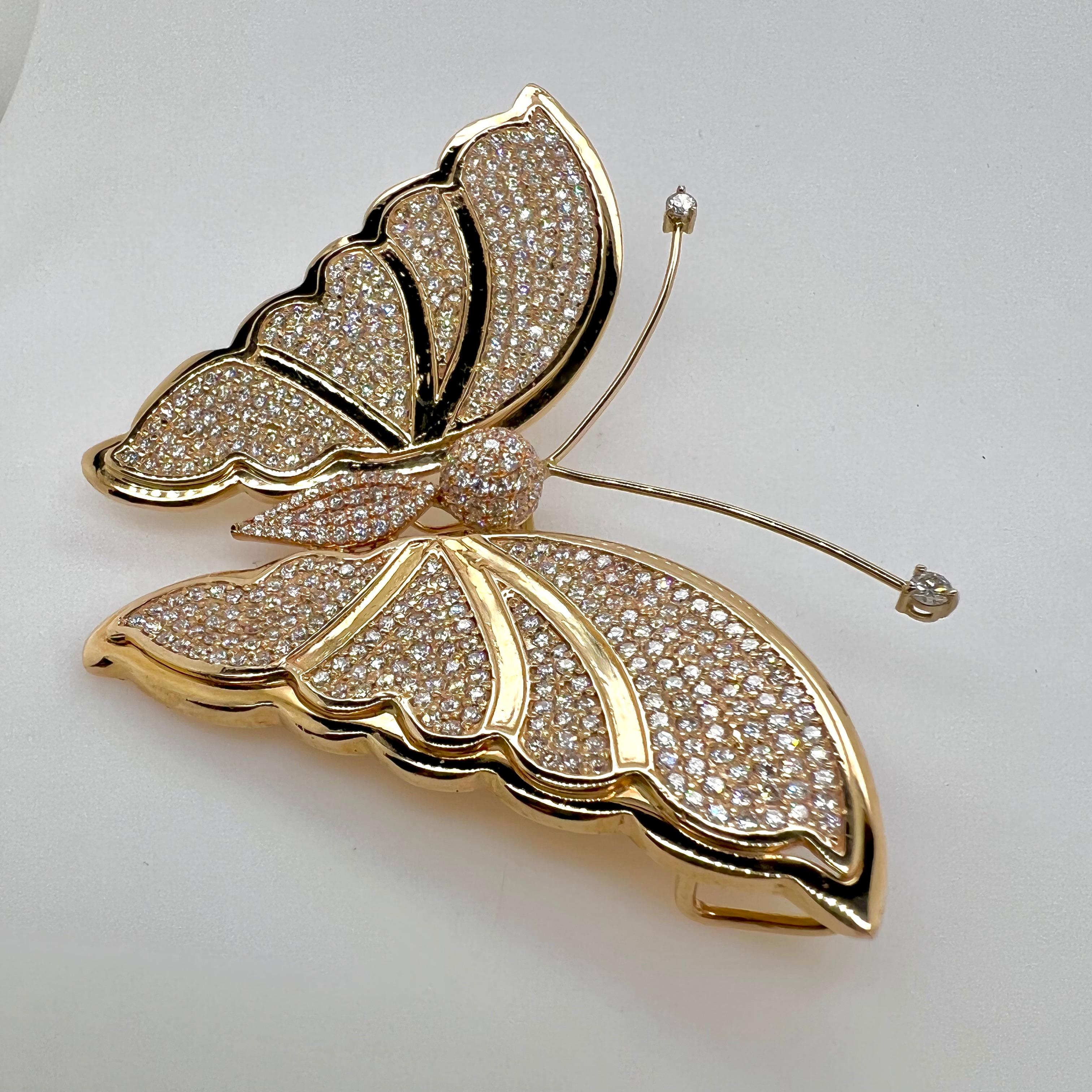 This dramatic diamond butterfly will be the talk of the town or party!  The butterfly has over 6 carats of diamonds and is hand made in 14k yellow gold.  The detailed wings give the butterfly a realistic look and is perfect for any smart casual