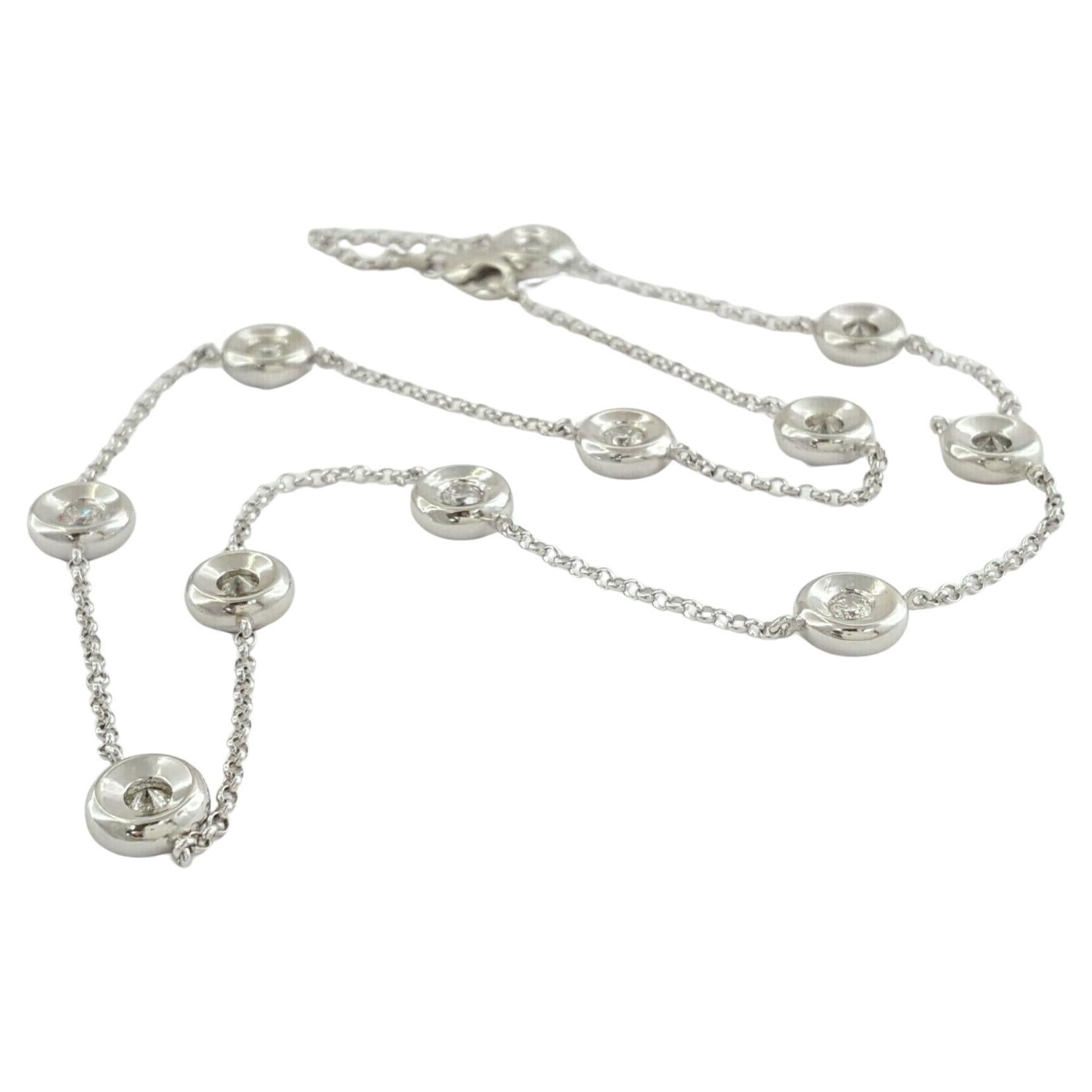  dazzling 1.4 carat Total Weight Round Brilliant Cut Diamond By The Yard Necklace in 14K White Gold. Weighing 13.8 grams, the chain boasts a length of 16 inches, with the option to add an extension if desired. The necklace features 11 Natural Round