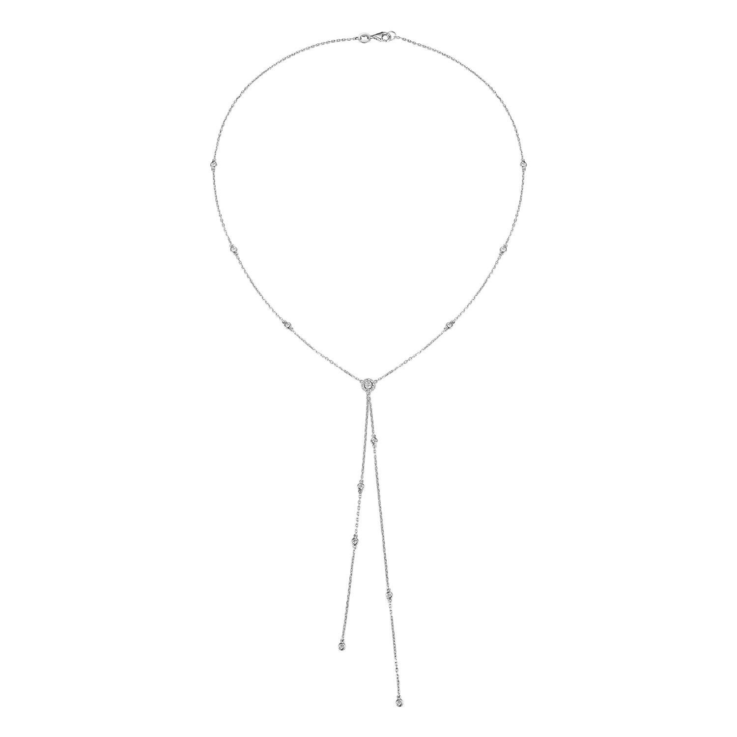 This necklace is a true embodiment of elegance, meticulously crafted from 18K white gold. Its lariat design creates a striking Y-shaped silhouette that gracefully highlights the wearer's décolletage. Embellished with diamonds totaling 0.33 carats,