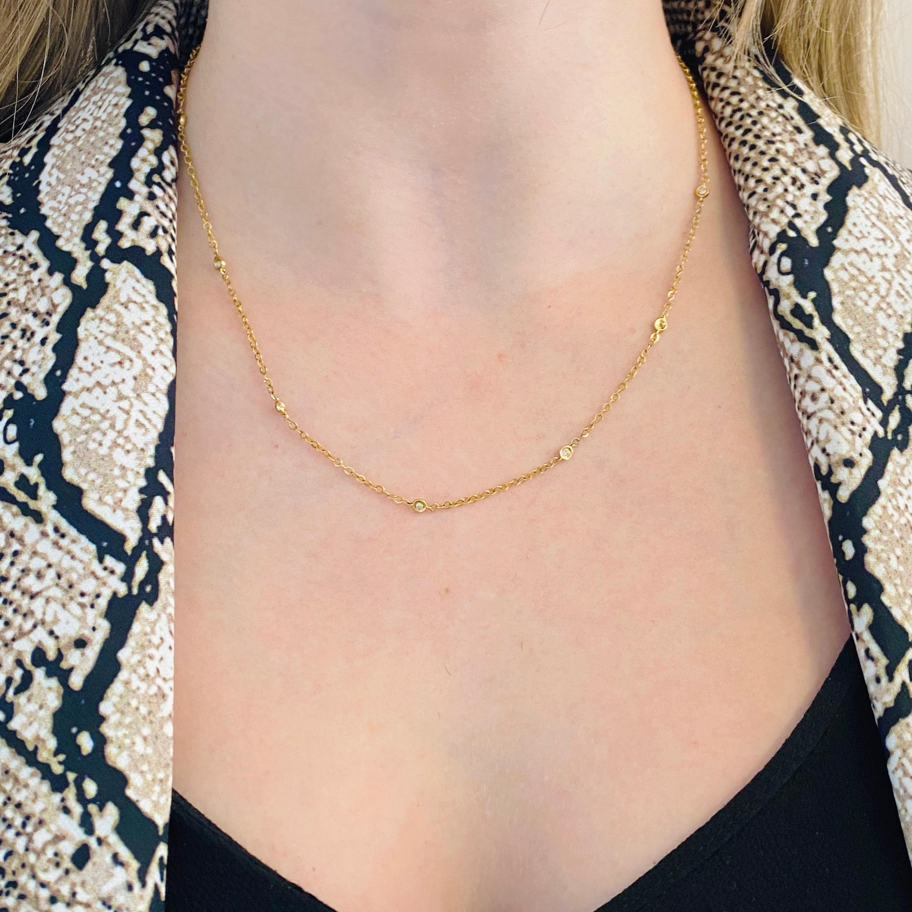 This diamond by the yard necklace has seven gorgeous diamonds. The diamonds are set in gold bezels and evenly spaced on the front of the necklace. This is a perfect necklace for layering.
Metal Quality: 14kt yellow gold
Chain Type: diamond by the
