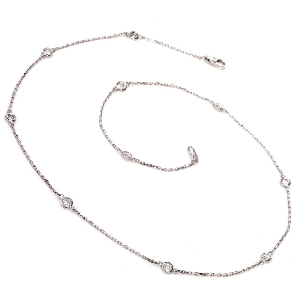 This diamond-by-the-yard necklace is crafted in 14 karat white gold, weighing 3.3 grams and measuring 18 inches long. This fashionable necklace is enriched with 10 round-faceted diamonds, weighing cumulatively 0.75 carats, graded H-I color and