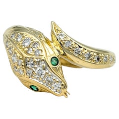 Diamond Bypass Style Snake Ring with Emerald Eyes Set in 18 Karat Yellow Gold