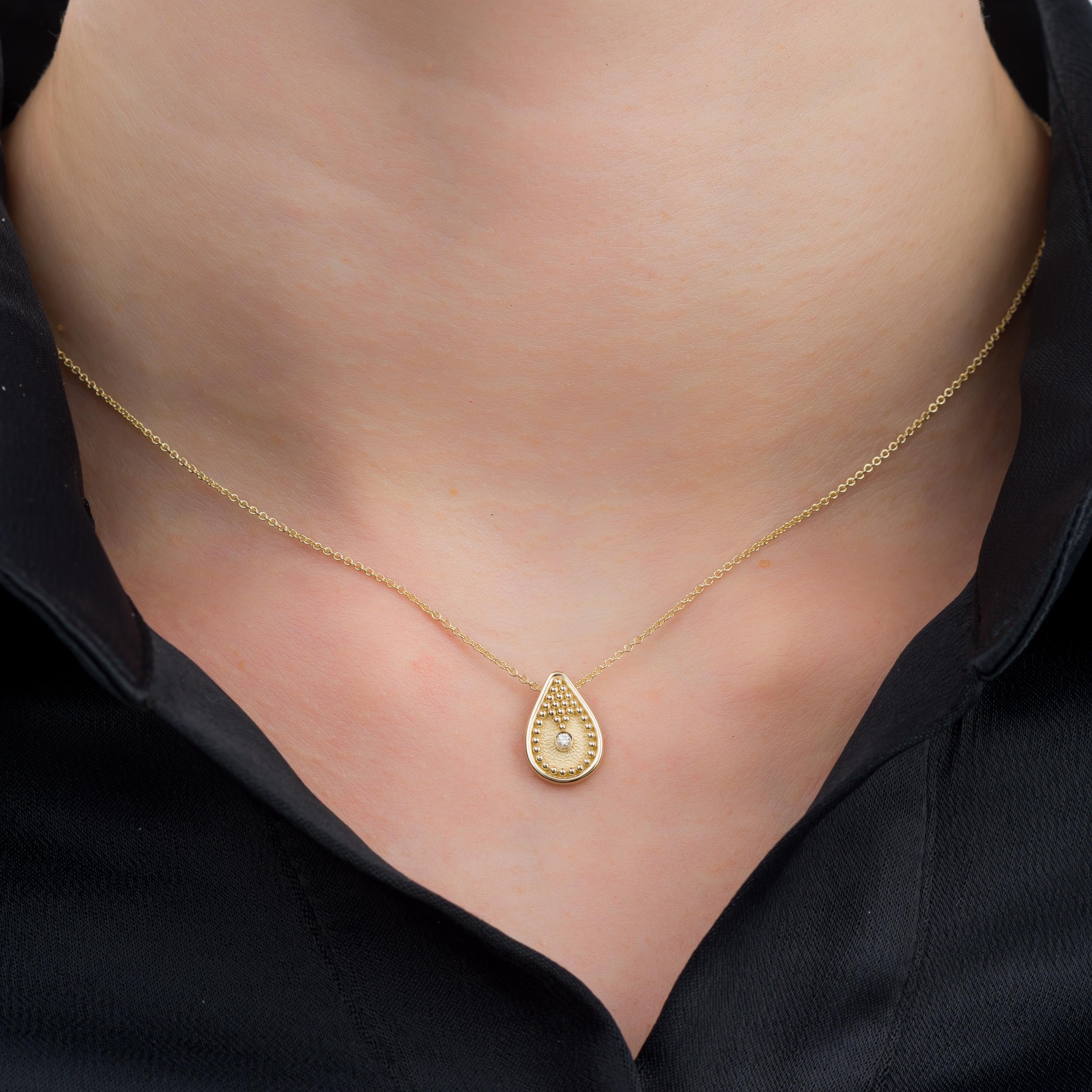 Elevate your style with a pear-shaped gold pendant, meticulously adorned with delicate granulations and featuring a radiant diamond at its heart, creating an exquisite piece that exudes timeless elegance and intricate craftsmanship. 

100% handmade