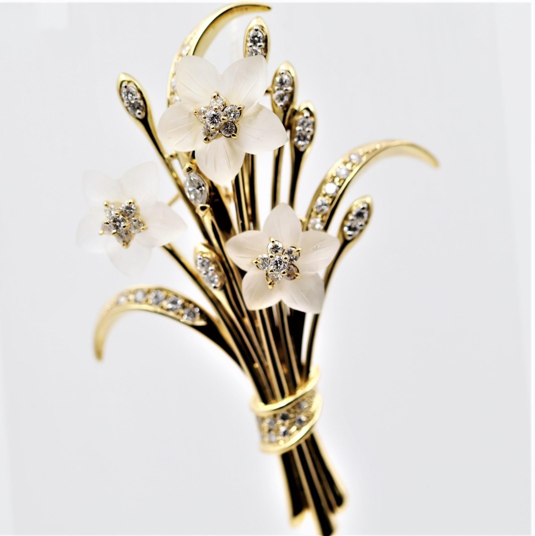 A lovely, detailed brooch featuring 1.24 carats of diamonds along with three flowers made of hand-carved quartz creating a bouquet of flowers. The attention to detail is very high as the realism of this piece sets itself apart. Made in 18k yellow